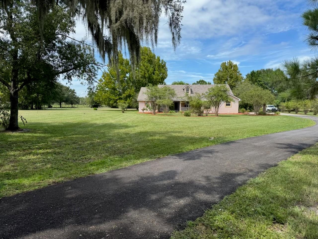Beautiful country home on 3.54 acres across from Lake Hamilton. This 3BR/2BA plus office features its own private entry, tile and laminate flooring, granite kitchen tops with island, whole-house water purification system, fenced yard, mature trees, landscaping and shed.