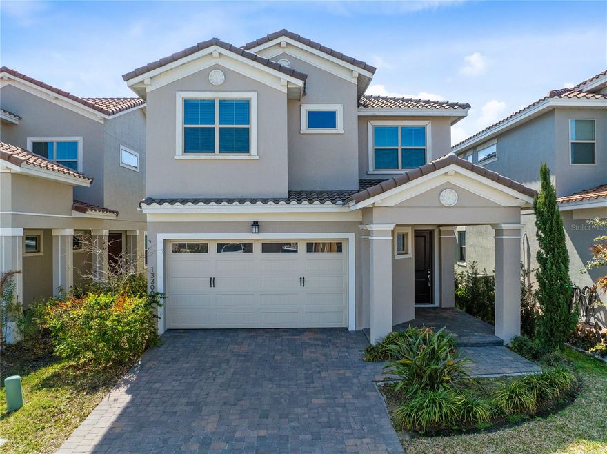 One or more photo(s) has been virtually staged. Welcome to this beautifully designed 2023 built home in the gated golf community of Eagle Creek. With a Mediterranean inspired elevation, tile roof, paver driveway, and covered front entry, this residence offers strong curb appeal and modern construction throughout. Spanning 3,180 square feet, the thoughtfully designed layout features five bedrooms, four and one half bathrooms, and flexible living space ideal for today’s lifestyle.

The main level showcases an expansive open concept design finished with long plank ceramic tile flooring, crown molding, and recessed lighting. The living and dining areas flow seamlessly into a spacious kitchen designed for both everyday function and entertaining. Rich wood cabinetry pairs with quartz countertops, a large island with seating, built in double ovens, stainless steel appliances, a vented hood, and subway tile backsplash. The oversized island overlooks the main living space, creating a central gathering point for family and guests. Sliding glass doors lead to the covered patio and backyard, bringing in natural light and extending the living space outdoors.

The first floor primary suite offers privacy and convenience, complete with tray ceiling detail, a spacious walk in closet, and a well appointed bath with tiled shower and double vanity. A highly functional design feature connects the primary closet directly to the laundry room, which includes a sink and additional cabinetry.

Upstairs, a generous loft provides additional living space ideal for a media room, home office, or play area. The second floor also includes three additional bedrooms and two full bathrooms, along with a true second primary suite featuring its own private bath and closet, offering excellent flexibility for guests or multigenerational living.

Built in 2023 with roof, AC, and water heater all from 2023, this home offers modern efficiency and peace of mind. Now vacant and move in ready.

Residents of Eagle Creek enjoy access to a championship golf course, resort style pools, clubhouse with fitness center, tennis and basketball courts, playground, and Eagle Creek Elementary located within the community gates.