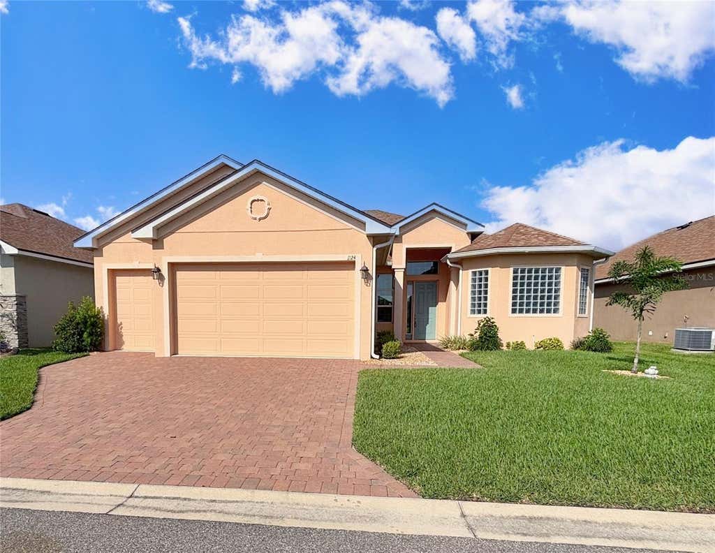 Photo of 1124 Sawgrass Drive, Winter Haven, FL 33884 (MLS # P4939422)