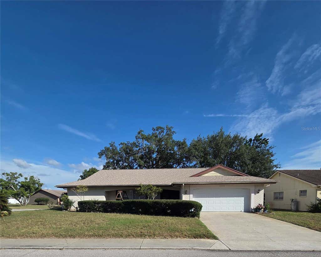 Photo of 12226 Meadowbrook Lane, Hudson, FL 34667 (MLS # TB8517837)