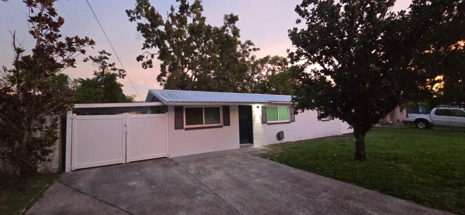 Move In Ready & Fully Renovated! This beautifully updated home offers 1,100 sq. ft. of brand-new tile flooring, a stunning kitchen with quartz countertops, upgraded electrical panel, and all new plumbing. Enjoy a spacious new Florida room, luxurious primary suite with double sinks and walk-in shower, fresh interior/exterior paint, new doors, windows, soffit, and a metal roof on the addition. All lighting, fans, outlets, baseboards, HVAC ductwork, and water systems are brand new. Fenced front and side yards for privacy. Truly turn-key and ready for its next owner!