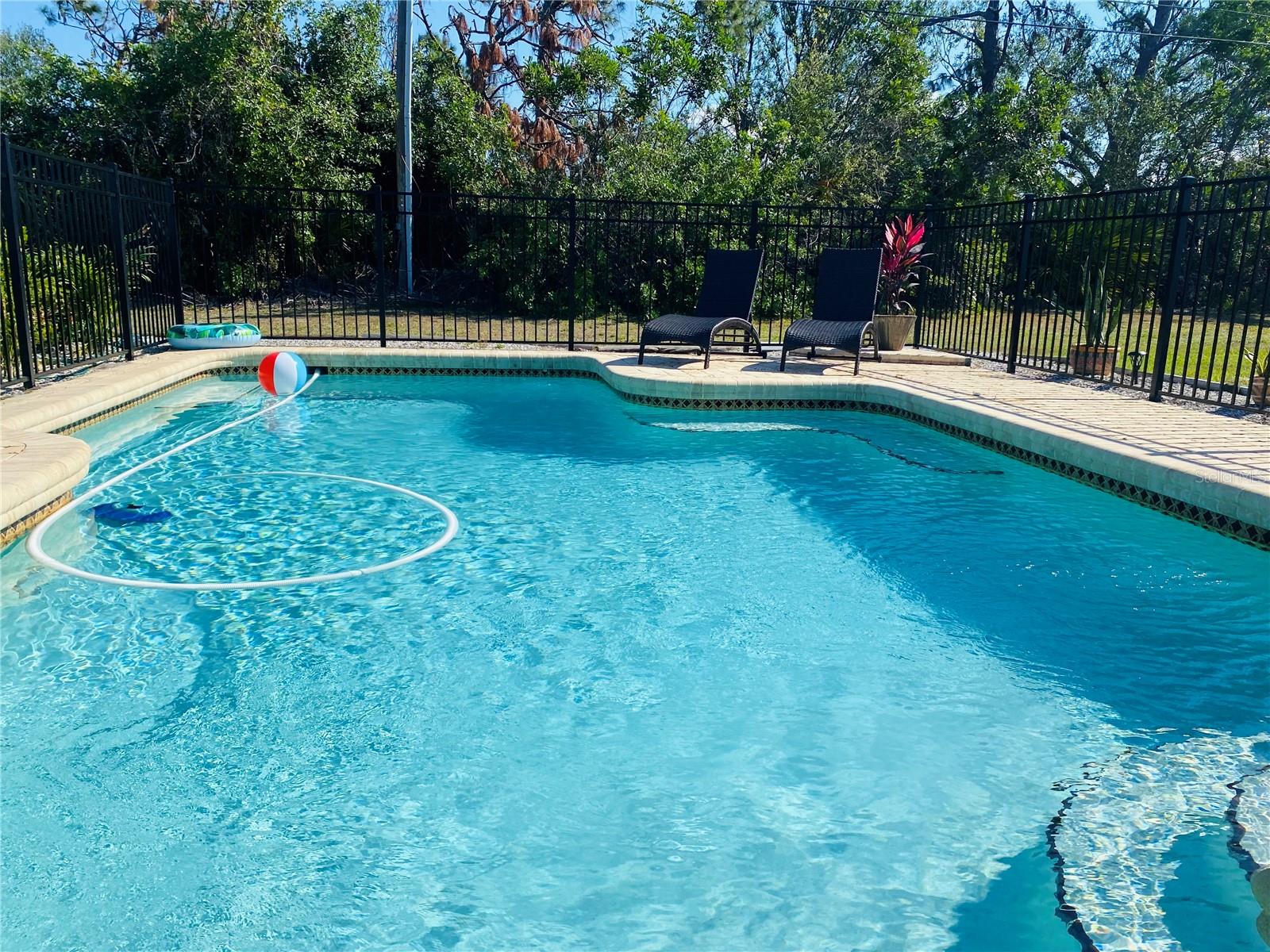 Fully furnished (turn-key) 2 Bedroom Pool Home nestled in a quiet & friendly Englewood neighborhood. Includes a private solar-heated pool, covered & screened patio lanai with gas BBQ, fully equipped kitchen, garage & private washer & dryer. Primary room has a comfortable King bed and guest room with a queen bed, both with additional bedding available. Generous side yard can securely store your RV or boat or great space for your fur baby to play! Home has all brand new hurricane-rated windows and doors throughout, front door security camera and keyless entry. Easy 15-20 min drive to public beaches or explore the surrounding areas like Sarasota, Venice & Fort Myers!