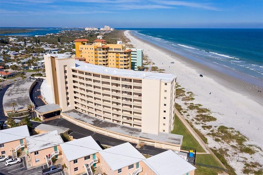 Enjoy spectacular ocean views from this very desirable end unit located at The Golden Arms!  This spacious, sun-filled 2 bedroom, 2 bath, 1,360 square foot condo with private balcony faces the rolling surf and panoramic view of the New Smyrna Beach.  Designer touches and quality finishes emanate from the minute you walk through the front door. The kitchen and baths have been extensively renovated along with the tile, interior doors, and light fixtures.  Colorful paint, window treatments, laundry/storage room, new sliding glass doors and newly installed HVAC system are just a few of this unit’s many amenities.  Most of the furnishings are included in the sale. The Golden Arms offers a heated pool, shuffleboard court, putting green, lushly landscaped courtyard area,  community room with kitchen, on-sight manager and one car assigned garage space.  This complex has a great rental history.  Located on north beach and just steps away from the shops and restaurants on Flagler Avenue, this fabulous condominium should be viewed in person to truly appreciate.  The best of both worlds awaits you at The Golden Arms! ;LocationDescription: Condo ;Water: City