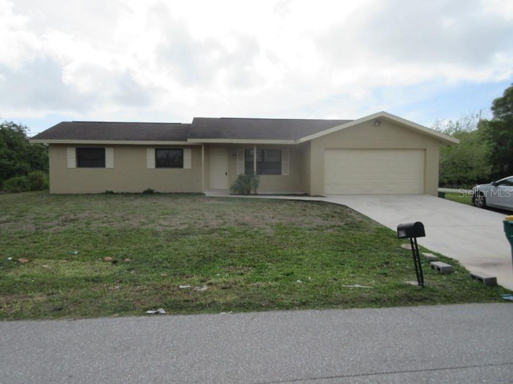Photo of 979 Roseway Terrace NW, Port Charlotte, FL 33948 (MLS # C7521152)
