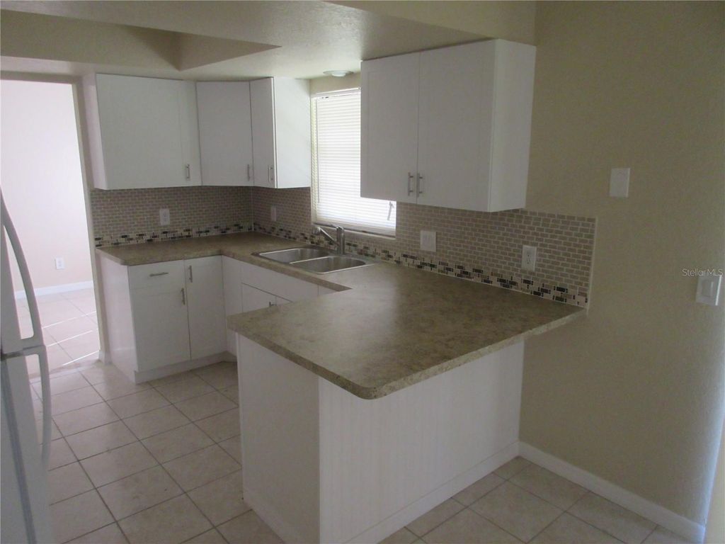 Photo of 979 Roseway Terrace NW, Port Charlotte, FL 33948 (MLS # C7521152)