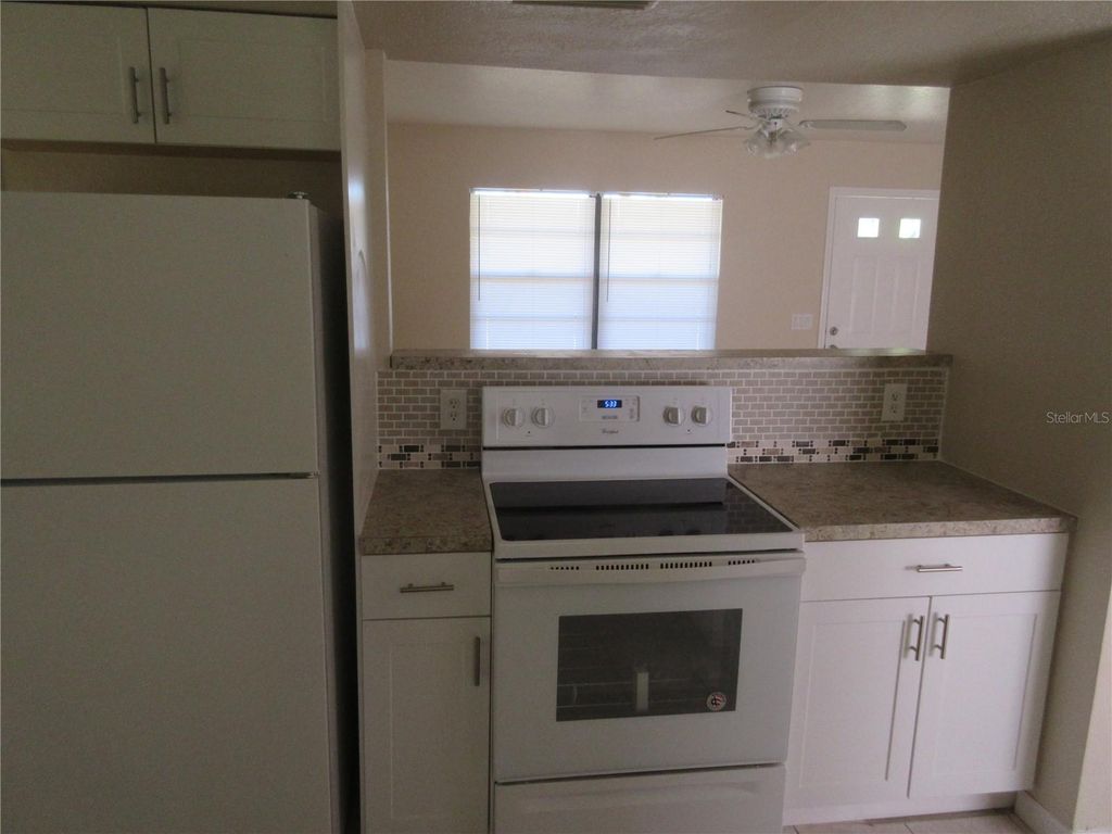 Photo of 979 Roseway Terrace NW, Port Charlotte, FL 33948 (MLS # C7521152)