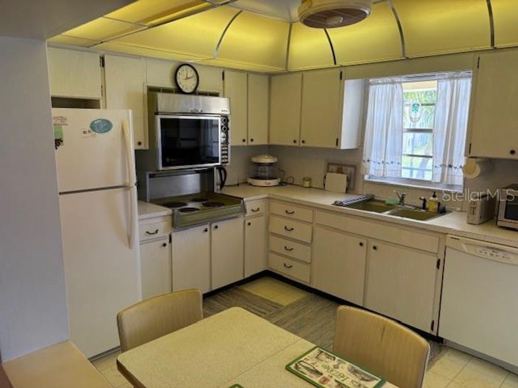 Photo of 4700 Cove Circle #203, St Petersburg, FL 33708 (MLS # TB8487707)