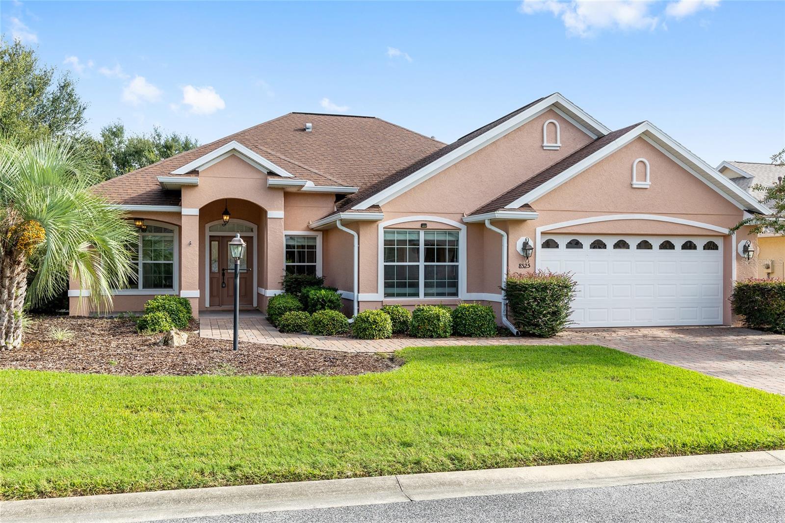 Welcome to this stunning Muirfield model home in desirable Candler Hills! Situated on a corner lot with mature landscaping, this rare 3-bedroom, 2-bathroom residence also features a versatile flex/hobby room. The chef's kitchen is beautifully appointed with oak cabinetry and stainless-steel appliances. Elegant crown molding flows throughout the home. The spacious garage includes a dedicated workshop area with its own split unit, plus extra cabinets and shelving for storage. Outdoor living shines with a covered, birdcage-enclosed lanai, a fenced backyard, and an expanded paver driveway. Enjoy the convenience of curbside trash and mail service, and take advantage of Candler Hills' lifestyle perks; including golf cart access to nearby shopping centers, plus exclusive use of The Lodge, the future Azura amenity, and the Candler Hills Community Center.
