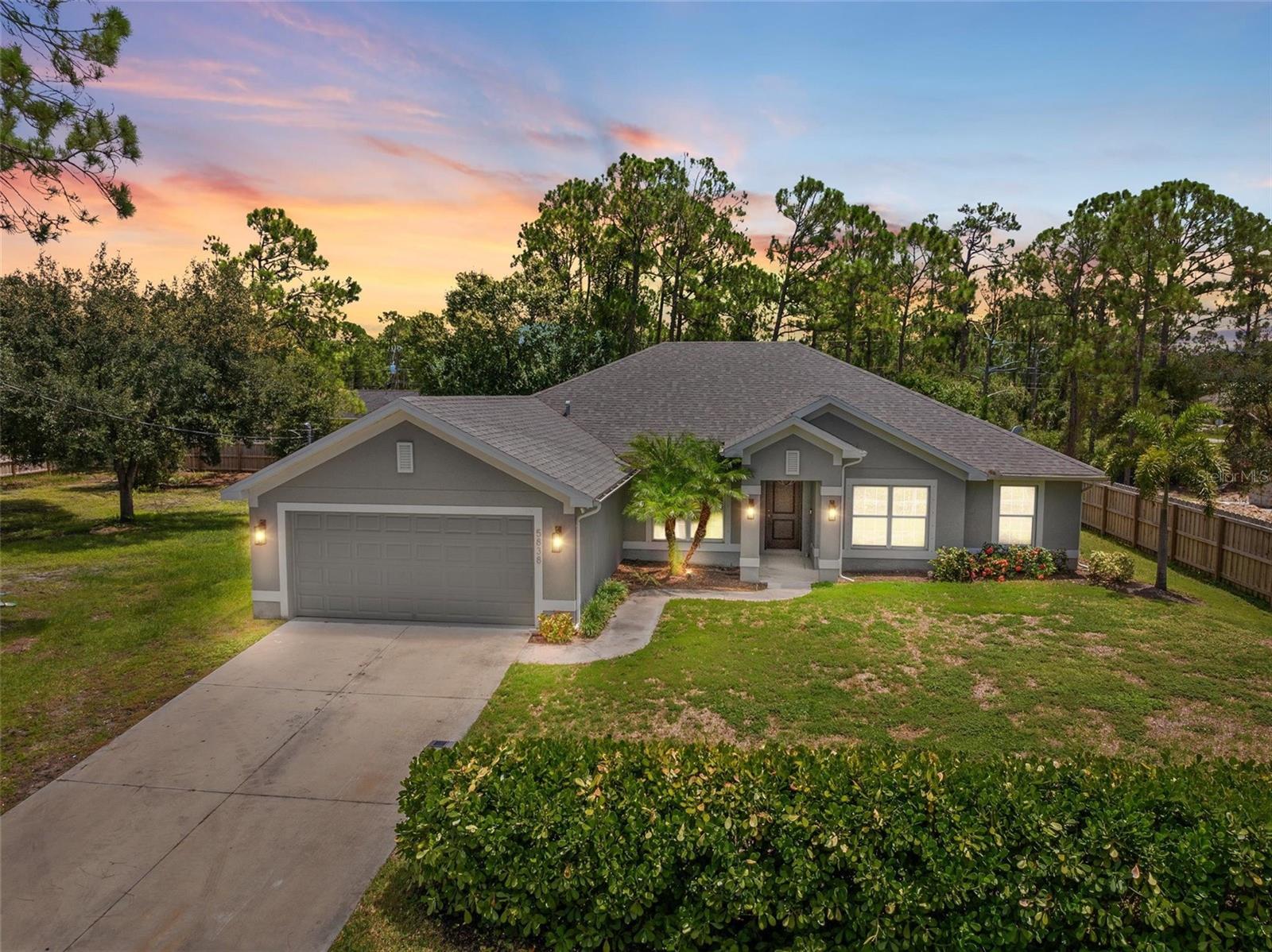 Tucked at the edge of North Port Estates, this spacious four-bedroom PLUS Den and Office home offers comfort, functionality, and privacy. NO HOA, NO Flood insurance requirements!
Inside, the expansive living area sets the stage for relaxed living and effortless entertaining, complete with custom built-ins and an electric fireplace that add a cozy, stylish focal point. A large granite island anchors the kitchen, providing the perfect space for cooking, conversation, or casual meals.
The thoughtful layout includes a dedicated home office with built-in shelving, plus a bonus room that adapts easily to your lifestyle—whether it’s a playroom, gym, or guest space. Each bedroom features its own walk-in closet, and the split floor plan ensures everyone enjoys their own space.
Step outside to appreciate the natural setting—this oversized lot includes the adjacent parcel, offering nearly half an acre surrounded by mature trees for extra privacy. There’s room for a future pool, plus a shed for added storage and a custom outdoor shower for rinsing off after a day outdoors. Smart home features like a Ring doorbell and Ecobee thermostat are already in place, and hurricane shutters and Generac hook-up for your generator provide peace of mind during storm season.
Enjoy easy access to nearby golfing, fishing, and the world-famous beaches making this the ideal blend of space, privacy, and convenience.