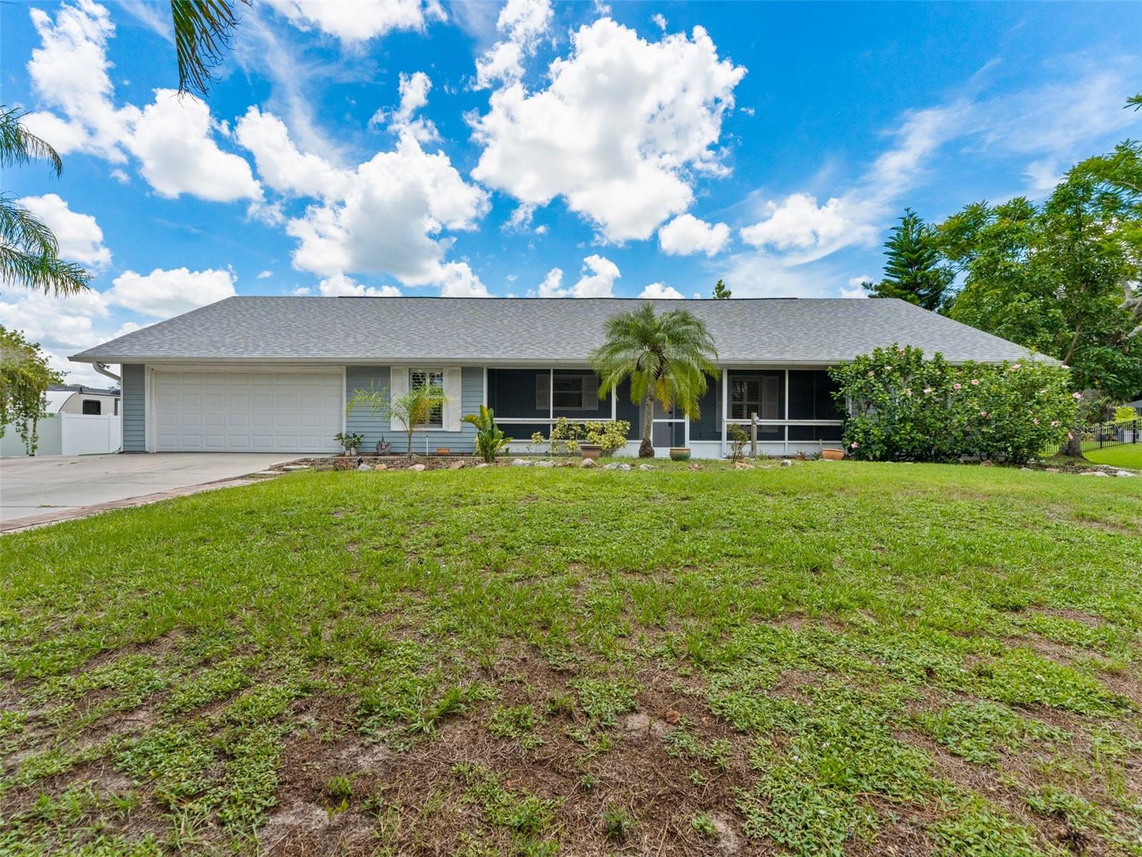 YOU CAN CHANGE THE WALLPAPER, BUT YOU CAN'T CHANGE THIS BEAUTIFUL SETTING & LOCATION! This is a fabulous value for a 3/2 on an acre lot in the Lakewood Ranch area! Significant price adjustment allows you more funds for reno. Opportunity knocks for the creative-minded buyer! This 3-bedroom, 2-bath home with a 2-car garage is located on a spacious 1.04-acre lot in a quiet development just north of Lakewood Ranch with all of the new services, stores, and amenities popping up daily in the area. Built in 1990, the home has a new roof in 2019, and water heater updated in 2019—giving you peace of mind as you focus on making decorative updates to truly make it your own.
The split-bedroom floor plan includes a generous primary suite that opens to the pool deck, with a walk-in closet with extra shelving. The ensuite bath has a step-in shower and lots of counterspace. Vaulted ceilings and sliding doors that open to your caged and heated pool make the living/dining area truly open concept. Plantation shutters throughout and a screened porch in the front. The garage currently serves as a rec room – but can be easily converted back to a garage accommodating two vehicles.
The backyard oasis has a wide view that overlooks a large, peaceful pond, plus mature shade trees. The two storage sheds have electricity and are perfect for tools, toys, or hobbies (you can have a he-shed, she-shed situation!)
No CDD fees, low HOA, this home is ideal for buyers who want to add their personal touch while building equity in a great location. This property has a remote and private feel, but is close to parks, shopping, and beaches. Priced to reflect the nostalgic interior. Bring your vision and make this your forever home!