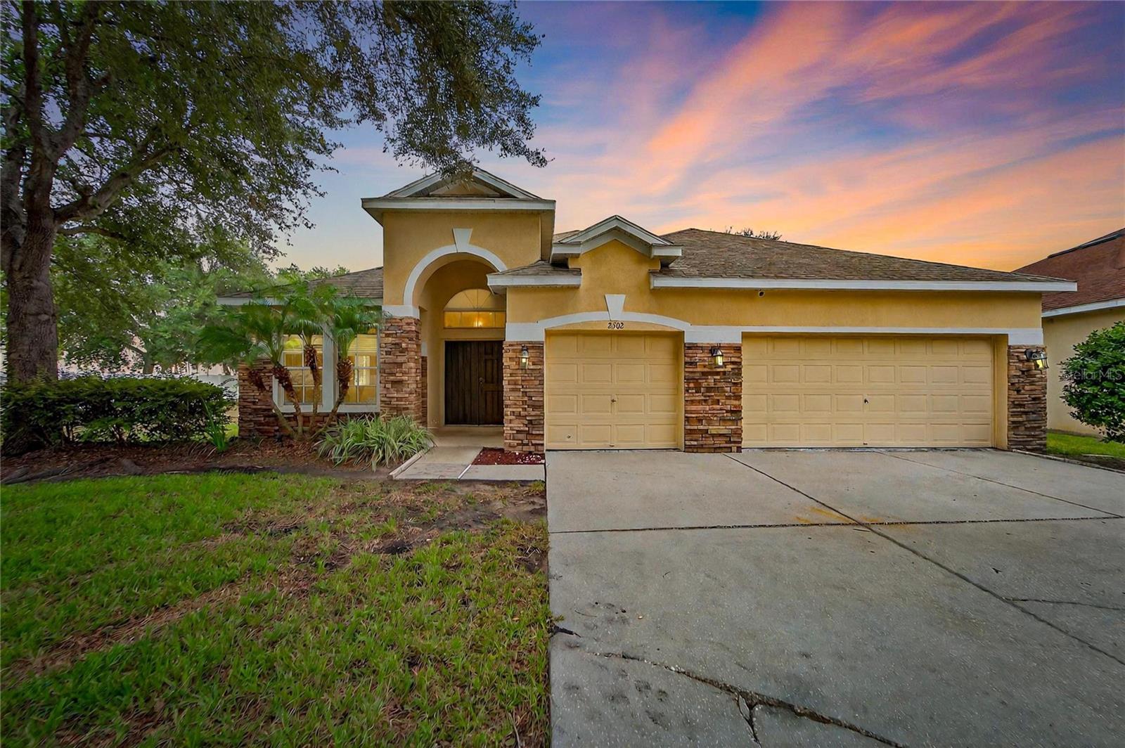 Look no further! This beautifully updated 4-bedroom, 3.5 bathroom home is located in the highly sought-after gated community of Bonterra in Valrico, FL. Sitting on nearly a half-acre lot (0.45 acres) within an A+ school district, this Taylor Morrison-built residence offers over 2,700 sq. ft. of thoughtfully designed living space. Step through the double front doors into a spacious layout featuring a formal living and dining room combo, flowing into an updated kitchen with granite countertops, solid cabinetry, and an eat-in nook overlooking the family room with an electric fireplace. The primary suite is located on the first floor, along with three additional bedrooms and two full bathrooms. Upstairs, a large bonus room with half bath and walk-in closet provides flexibility as a 5th bedroom, media room, playroom, or home office. Recent updates include newer flooring and fresh interior paint, ensuring this home is truly move-in ready. Outdoors, enjoy a 3-car garage, cul-de-sac lot, and no rear neighbors—offering privacy and tranquility. All this within a serene gated neighborhood, just minutes from shopping, dining, major highways, top-rated schools, and a local golf course. This home has it all—space, upgrades, and an unbeatable location!