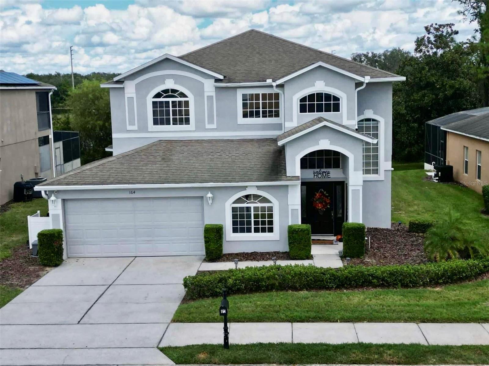 Welcome to your dream home! This exquisite 5-bedroom, 3-bathroom property is perfect as a primary residence or an income-producing short-term rental.
As you enter, you are greeted by a grand two-story foyer that sets the tone for the elegant design throughout. The open floor plan seamlessly connects the spacious formal dining and family rooms, featuring beautiful arched doorways that enhance the home's charm. The living area is anchored by a custom-built entertainment center with adjustable lighting and an electric fireplace, creating a cozy atmosphere for relaxation or entertaining.
The well-appointed kitchen boasts a smaller pantry and a brand-new stainless steel Whirlpool dishwasher (purchased in February 2025). Large sliding glass doors lead to an enclosed in-ground heated pool and spa, perfect for year-round enjoyment and entertaining guests. Conveniently located on the first floor is the laundry room, an updated walk-in pantry, a full bathroom, and a versatile bedroom ideal for in-laws, guests, or a home office.
Upstairs, you’ll find an open landing suitable for an office area, alongside three additional bedrooms and a beautifully designed full bathroom with sliding shower doors. The expansive main suite is a true retreat, featuring sliding glass doors that open to a private covered balcony, offering breathtaking views of sunsets, sunrises, and even fireworks. Enjoy the tranquility of having no rear neighbors and the serene pond view. The main suite also includes a luxurious bathroom with a soaking tub, glass shower, water closet, and an oversized walk-in closet.
This home also boasts a spacious two-car garage and is equipped with several upgrades, including a resurfaced pool (2023), a new pool heater (2024), a brand-new AC unit (2024), and a dishwasher (2025).
Located in the highly sought-after gated community of The Shire in West Haven, residents enjoy resort-style amenities such as a clubhouse, pool, fully equipped gym, tennis courts, and volleyball. The HOA covers clubhouse access, landscaping, cable, high-speed internet, and pest control.
Conveniently situated just minutes from Orlando International Airport and major daily shopping stores like Walmart, Target, and Lowe’s, you'll have everything you need at your fingertips. Local entertainment options include a movie theater, diverse dining choices, a new indoor park, North Eastern Regional Park, gyms, and the Davenport Community Center. Plus, you’ll find yourself equally distant to beautiful beaches on either coast.
Priced to sell—this is an opportunity you don’t want to miss! Schedule your private showing today!
