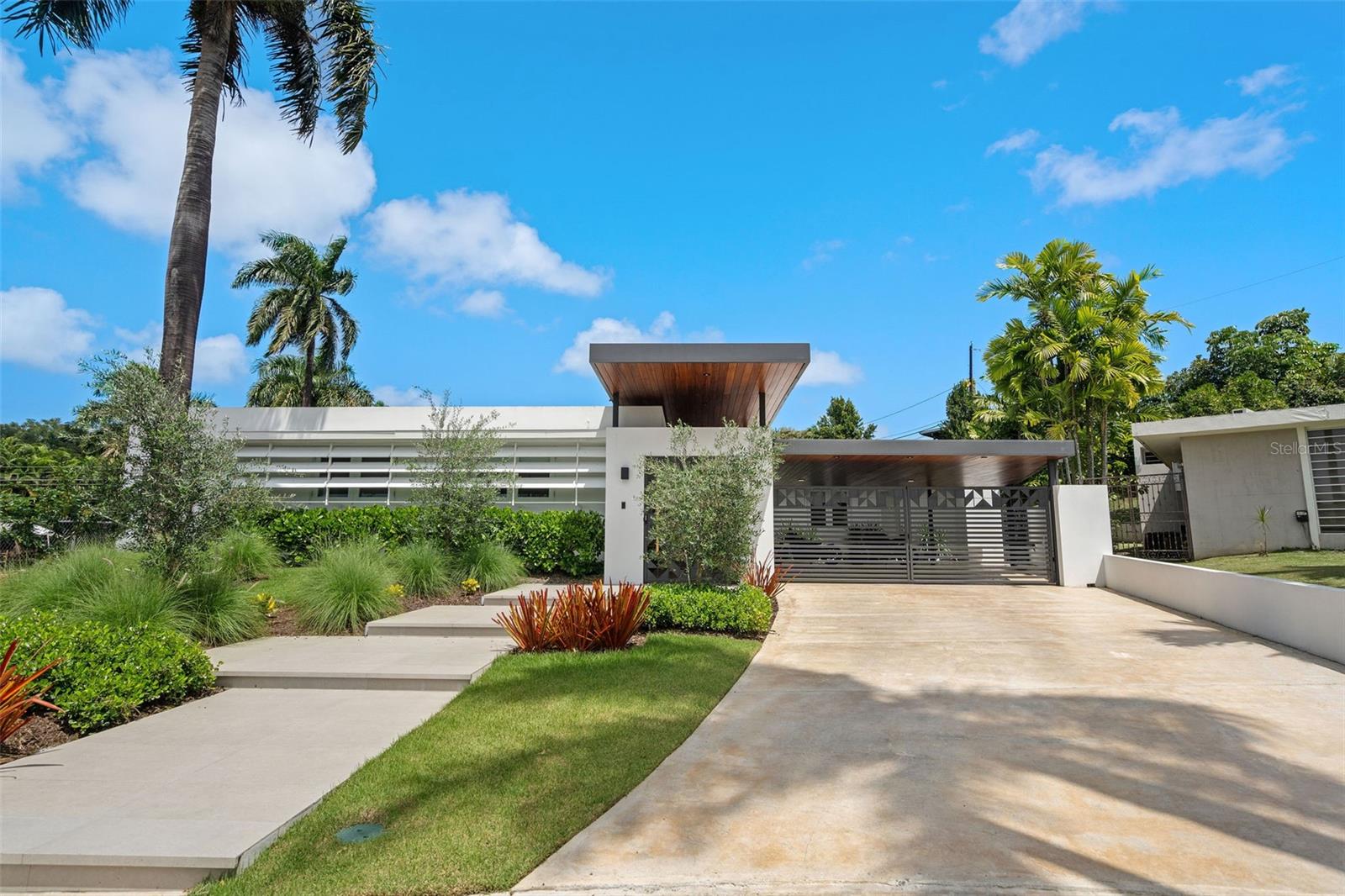 “THE BEST OPPORTUNITY IN TORRIMAR - RECENTLY REMODELED – LARGE LOT – LOCATION” READY TO MOVE IN!!
Welcome to your dream retreat located in the gated community of TORRIMAR, Alhambra Street, GUAYNABO, Puerto Rico! Step into luxury living with our meticulously renovated resort-style home, where every detail has been carefully crafted for ultimate
comfort and sophistication.
The house has an area of 3,726 square feet and sits in a 1,264 square meter lot. Open floor plan, 4 bedrooms, office, guest room, family, 4 bathrooms, powder room, and laundry. Gourmet kitchen with top-of-the-line appliances; Wolf microwave & double oven, Cove dishwasher, Subzero refrigerator/freezer, and LG washer/dryer. The back yard includes spacious terrace, outdoor kitchen/bar, powder room, outdoor shower, open-covered terrace, pool, barrel 6-person pine sauna, cold plunge tub, pool, soothing spectacular landscaping. The home also includes Lutron lighting control system, Sono’s sound system, CCTV server storage with 13 cameras, full diesel power generator, solar water heater and water cistern. Gated carport with a 2-car capacity and driveway area for 2 additional cars. TAXES-$4,932/year, HOA-$140/month.
Nestled in a serene setting, this TURN-KEY property invites you to indulge in the epitome of relaxation and convenience. From the moment you walk through the door, you'll be greeted by a seamless blend of modern elegance and timeless charm.
With recent renovations sparing no expense, this home boasts state-of-the-art amenities and stylish finishes throughout. Whether you're unwinding in the lavish master suite, entertaining guests in the spacious living areas, or soaking up the sun in the lush outdoor oasis, every inch of this home exudes luxury and tranquility.
Torrimar Development Amenities -Gated community, 24/7 security, activity center, playground. Conveniently located in close proximity to private schools, fine dining, shopping centers and many other places of interest.
Don't miss your chance to experience resort-style living every day. Your perfect getaway awaits – schedule a viewing today and make this stunning retreat your own!
Will go fast, Just call today!
