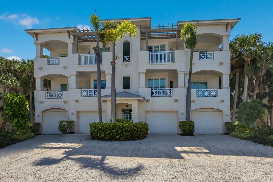 Located in the private gated community of Boca Bay South Village is a 3 bedroom, 2 1/2 bath “Harborside" waterfront end-unit condo with unobstructed bay views of Charlotte Harbor. The courtyard leads you to the main entrance or an elevator greets you at the foyer of this 3 bedroom, 2 1/2 bath, residence featuring a one level open plan with 10’ volume ceilings, white hardwood oak flooring throughout, and a screened lanai. The living space flows seamlessly, taking full advantage of the mesmerizing bay views. A well-designed kitchen with tray ceiling is outfitted with stainless steel appliances, custom cabinetry, tile backsplash and blue bahia counters. The expansive waterfront master suite boasts a bayfront screened lanai, crown molding, high ceilings and dazzling views of the harbor. Additional main floor area includes two guest bedrooms with balconies, a full bath and a half bath. Boca Bay community offers 4 swimming pools, fishing pier, gulf-side dining, 7 tennis courts and a well-equipped fitness center. Private one-car garage with plenty of storage.