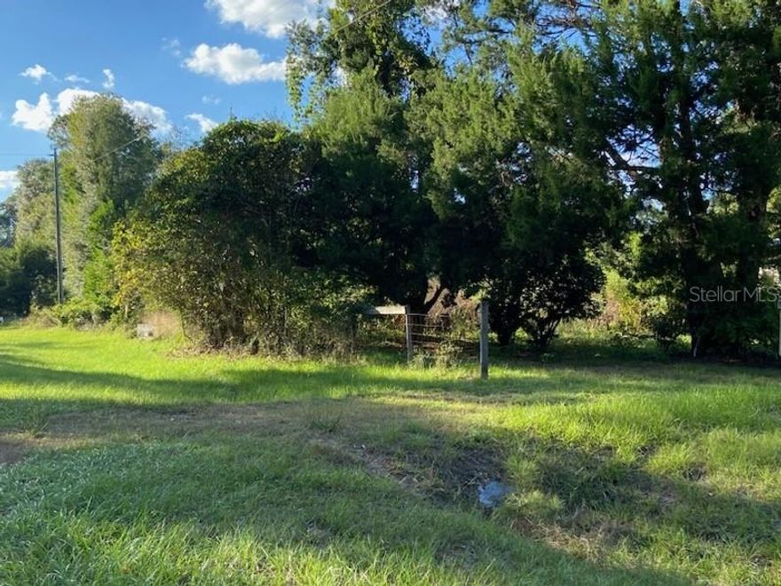Escape the hustle and bustle with this serene 5+ acre countryside parcel. Level, usable land surrounded by nature—ideal for livestock, gardening, hobbies, or a future custom home. Enjoy privacy without sacrificing convenience: minutes to restaurants, shopping, and interstate access for easy commuting. Key features include paved road frontage, nearby utilities, no flood zone reported, and low taxes. Create your own Florida retreat, hold as an investment, or build now. A peaceful slice of the outdoors with room to spread out and breathe. Buyer to verify measurements, zoning/land use, utilities, and restrictions.