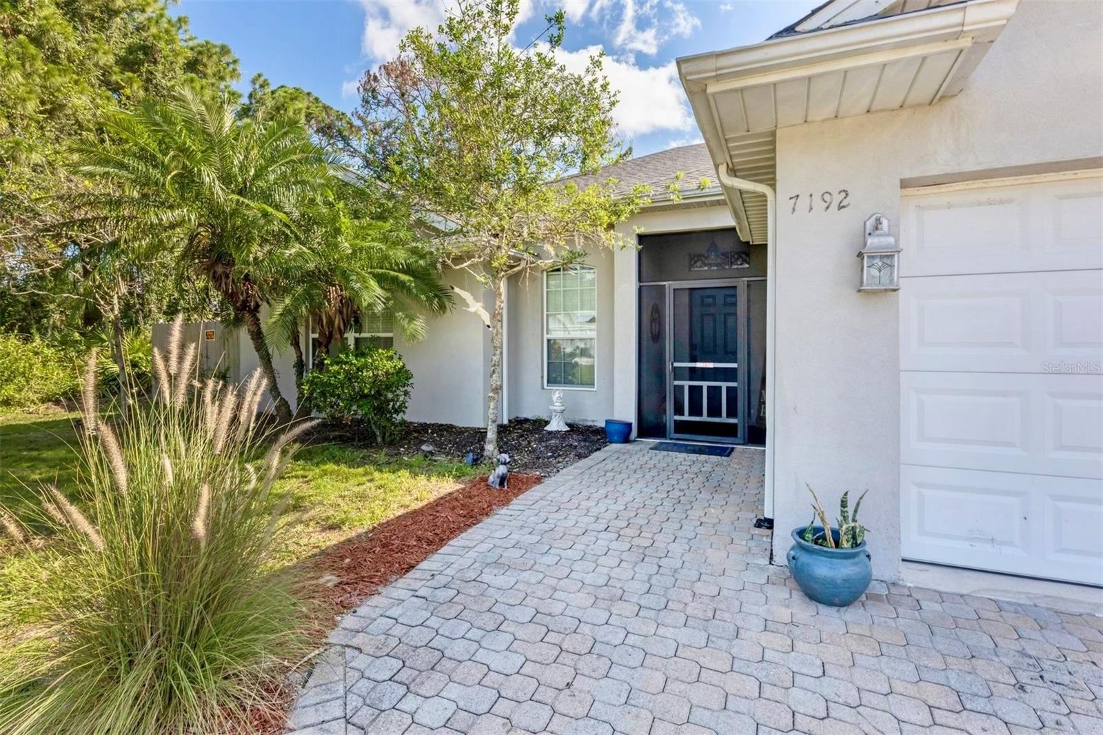 Discover the charm of 7192 N Paragon Road—a move-in ready 3 Bedroom, 2 Bath North Port home offering spacious living, thoughtful updates, and the serene lifestyle you’ve been searching for with truly a tropical backyard oasis! Thoughtfully designed and meticulously maintained, this property features a NEW ROOF (2023), Insulated Concrete Form (ICF) Exterior Walls, R38 Attic Insulation, Double-Pane UV-Coated Windows, and a High-Quality Water Treatment System—providing lasting value, energy efficiency, and peace of mind.
Step inside to a warm and welcoming layout with beautiful oak hardwood floors, an abundance of natural light from quadruple sliding glass doors, and a spacious open floor plan perfect for everyday living or entertaining. The kitchen is the heart of the home, showcasing Spanish tile flooring, wood cabinetry, stainless steel appliances, a stylish backsplash, and a cozy eat-in dining area. The split-bedroom design offers added privacy, with a generous primary suite featuring custom walk-in closets, dual vanities, a walk-in shower, and a separate soaking tub for total relaxation. Two additional guest bedrooms are tucked away with a well-appointed bathroom, ideal for family or visitors.
Outside, enjoy Florida living at its best with a screened paver lanai overlooking a peaceful pond and lush tropical landscaping. The backyard is a private retreat, complete with a fire pit, outdoor swing, storage shed, and a fenced area for pets—perfect for both quiet mornings and weekend gatherings.
Located in a tranquil North Port neighborhood, this home offers easy access to top-rated schools, I-75, shopping, dining, the Atlanta Braves Spring Training Facility, and beautiful Gulf Coast beaches. While the home sits in Flood Zone B, most lenders do not require flood insurance (buyer to verify with their lender and insurance provider).
Whether you're seeking a full-time residence or a smart investment opportunity, this home checks all the boxes. Don’t miss your chance to own this tropical retreat—check out the virtual tour and schedule your private showing today!