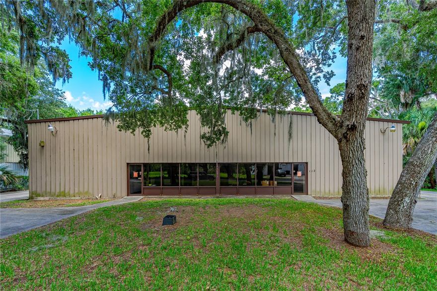 16,000 SQUARE FEET OF USABLE SPACE THAT INCLUDES SHOWROOM, OFFICES AND WAREHOUSE STORAGE OR MANUFACTURING SPACE WITH LARGE OVERHEAD DOORS IN A VERY CONVENIENT AND ACCESSIBLE LOCATION. 1,368 SQFT OF FRONT SHOWROOM ACCENTED WITH STOREFRONT WINDOWS AND TWO COMMERCIAL STOREFRONT ENTRY DOORS. TWO OFFICES AND TWO ½ BATHS LOCATED OFF FRONT SHOWROOM. SECOND STORY INCLUDES AN ADDITIONAL 2,400 SQFT WITH FOUR ADDITIONAL OFFICES, ½ BATH AND STORAGE MEZZANINES. WAREHOUSE STORAGE/MANUFACTURING AREA IS 11,200 SQFT OF FLOOR AREA, WITH 7 OVERHEAD BAY DOORS. TWO OF THE OVERHEAD DOORS ARE 14’X10’ AND THE OTHER FIVE ARE 10’X10’. BAY AREA HAS 3 EXTERIOR WALK-THRU PASSAGE DOORS AND TWO ADDITIONAL ½ BATHS. NEW ROOF IN 2021 AND HAS EXISTING 3-PHASE POWER. THERE IS AN ADDITIONAL 1.77-ACRE CORNER PARCEL ADJACENT TO THIS LISTING AVAILABLE THAT FRONTS W. PARK AVE. THAT WOULD COMPLEMENT THIS PURCHASE.

ACCESS & LINKAGES:
DISTANCE TO I-95 – 4.2 MILES
DISTANCE TO I-- 4 21 MILES
ORLANDO – 58 MILES
JACKSONVILLE – 112 MILES
TAMPA – 142 MILES
MIAMI 242 MILES