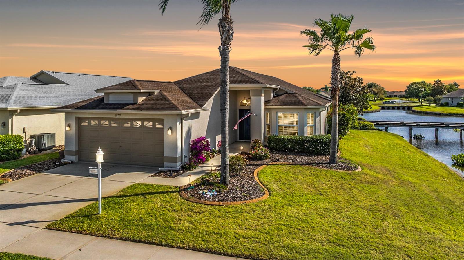 Step into a picturesque retreat where every day feels like a getaway. ROOF REPLACED 2013; EXTRA DEEP GARAGE FOR ADDITIONAL STORAGE. This home offers more than just stunning views—it promises a lifestyle immersed in luxury and comfort. Beyond the spacious garage, uniquely extended for extra convenience, discover a thoughtful floorplan designed to maximize light and views from every angle. From the serene living and dining areas to the kitchen adorned with pristine white cabinets, every corner of this home frames panoramic vistas of the golf course and tranquil pond. The master suite, overlooking the peaceful waters, provides ample room for relaxation and includes a spacious vanity for all your storage needs. A versatile den off the great room awaits for your special touch, there's plenty of space in this 2 bedroom, 2 bath home for both guests and personal hobbies. However, the true highlight awaits outdoors: a screened lanai perfect for leisurely mornings and evenings, where you can soak in the beauty of the surroundings. This home isn't just a place to live—it's a sanctuary where luxury meets everyday tranquility, offering an unparalleled resort-style living experience.. 55 & FUN - LIVE THE HERITAGE SPRINGS LIFESTYLE - Resort style living at its absolute finest! Clubhouse with restaurant and bar, fitness, tennis, golf, cards, billiards, dancing and more! SUPERB TRINITY LOCATION, CLOSE TO BEACHES, DINING, SHOPPING, MEDICAL AND AIRPORT! Caution - Adults at Play!