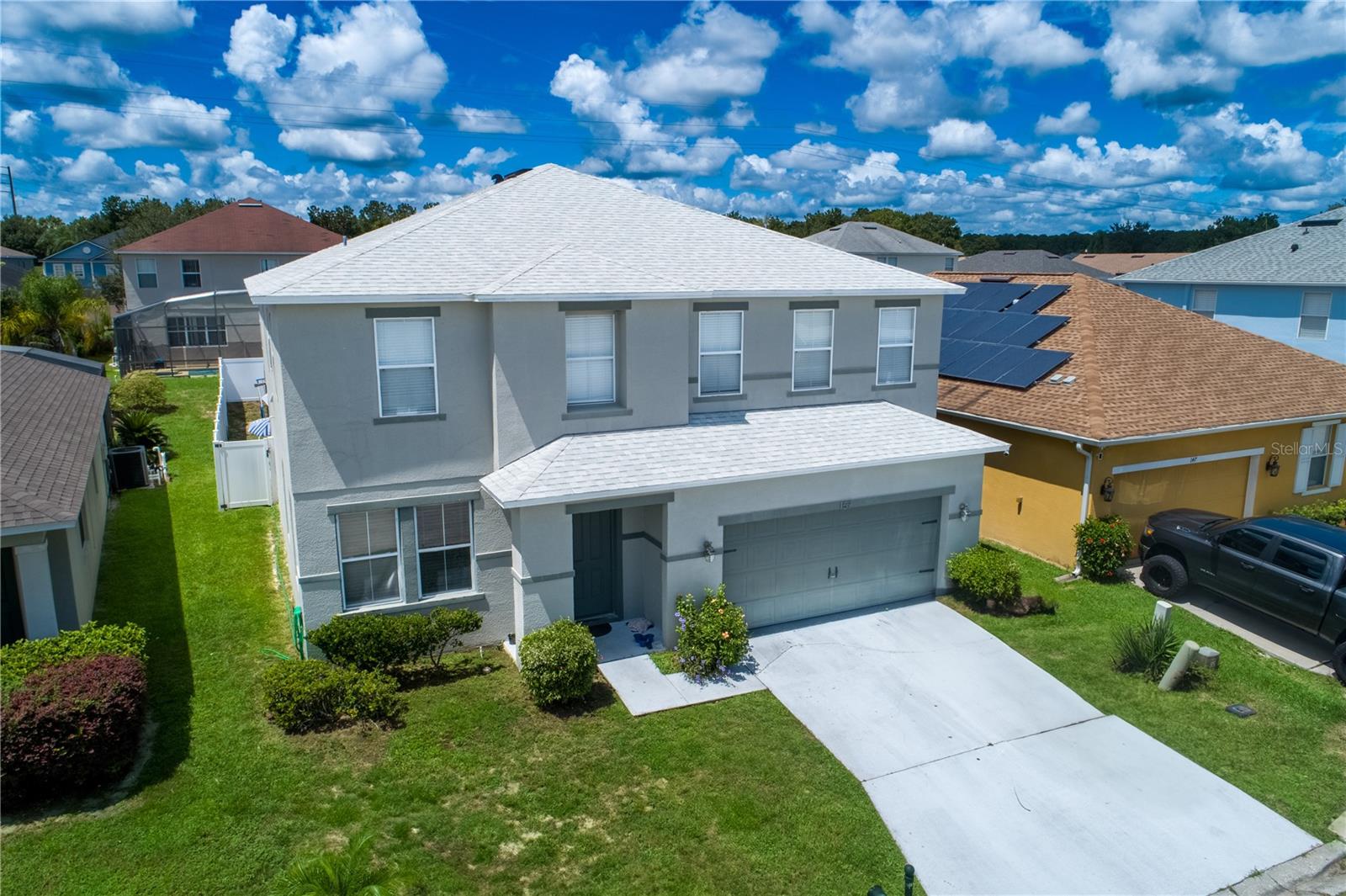 Spacious 5-Bedroom Pool Home in Windwood Bay. Located in the desirable Windwood Bay community, just minutes from Champions Gate, I-4, and all of Central Florida's top attractions, this beautifully maintained home offers over 3,300 sq. ft. of living space. Currently used as a second home and vacation rental, it features a bright, open floor plan with 5 bedrooms, 4 full bathrooms, and a versatile loft that can easily be converted into a 6th bedroom if desired. The main level includes a formal living and dining area, a spacious family room, a breakfast nook, and a chef's kitchen with a center island, breakfast bar, and granite countertops. A first-floor en-suite bedroom adds convenience for guests. Upstairs, you'll find the expansive primary suite with a large sitting area, a second en-suite bedroom, two additional bedrooms with a shared bath, plus a dedicated laundry room. Enjoy Florida living at its best in your private screened-in pool and spa, complete with a half bath on the pool