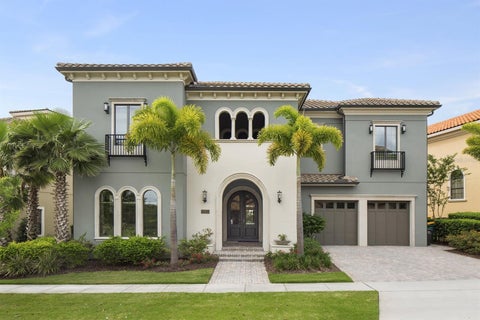 Photo of 445 Muirfield Loop, Reunion, FL 34747 (MLS # O6435234)
