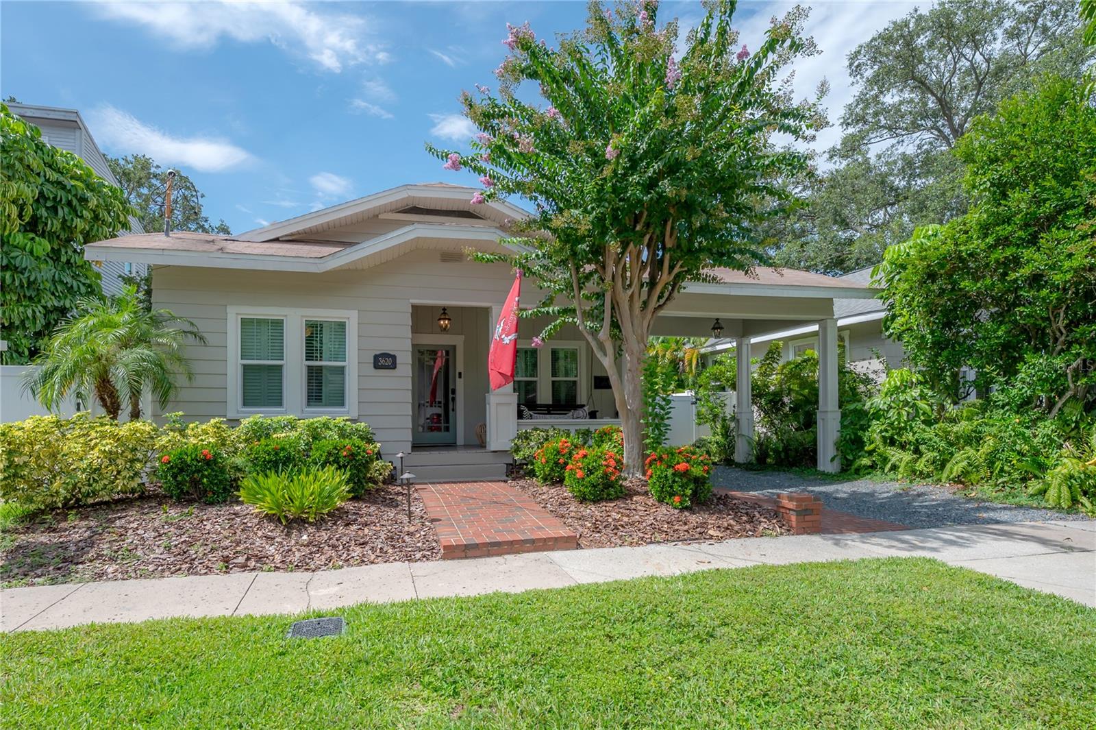 Pristine Executive Rental. This impeccable and updated 1920s Craftsman bungalow retains its timeless character while also being ideally located minutes from Bayshore Boulevard, Hyde Park, MidTown, MacDill, the Leroy Selmon Expressway and DownTown. This bungalow is perfect for remote work with a sun filled dedicated office adjoining the elegant formal living room. Bedecked with bamboo flooring, built-ins, and a fireplace, the cozy yet elegant formal living conveys comfort and charm with high ceilings and bespoke attention to detail. Designed to flow, transitioning between the open-concept kitchen, dining, and family room feels comfortable and easy. The primary suite is highlighted by its private en suite bath. Exterior updates to this handcrafted home include 15 hurricane-rated windows, a newer architectural shingle roof, an updated HVAC system, and a tankless water heater for endless warm showers. The sidewalk facing entry porch delights with a comfortable porch swing for morning coffee, and full-property lighting provides security and vibrance to both the front and backyard of this quaint charmer. This thoughtfully updated South Tampa gem is available to lease now to provide you ease of access to all that South Tampa offers while still providing a quiet respite to relax or entertain in while living the Tampa Bay Lifestyle.