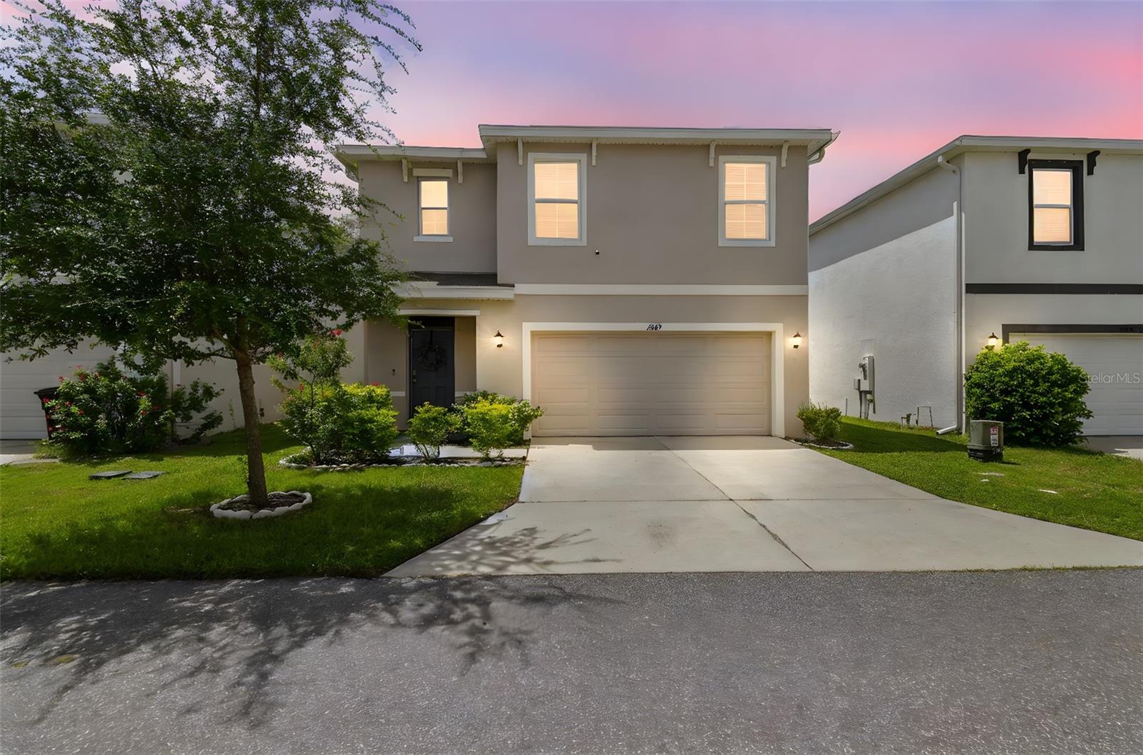 Welcome to Trinity Woods, a newer community since 2020, tucked away in New Port Richey, FL. A DR Horton community built only 75 homes to make it quaint and quiet, this community is zoned for highly rated schools and near to medical, grocery, entertainment, restaurants and shopping. US 19 is close by for easy travel. This great home brings you 5 bedrooms, 3 full bathrooms, and a 2 car garage. Move in ready with open floor plan and modern design. Granite throughout. Stainless steel appliances. LOW HOA at only $91/mo, NO CDD, NO FLOOD ZONE. Two-story home built with concrete block. Attractive exterior and landscaping provides a warm welcome. Smart home that comes with DR Horton's "Home is Connected" system. Lovely split entrance that welcomes you to the heart of the home. This common sense floor plan provides great entertaining space while also being cozy. There is a BEDROOM ON THE MAIN LEVEL. Tall ceilings, designated dining room space, gorgeous light and bright kitchen with stone counter tops, ample storage with additional seating at the island. Comfortable living room space with great views. Upstairs enjoy the loft area before heading to the large bedrooms. Primary is tucked away for privacy and offers an ensuite with dual sinks and walk-in closet. The other bedrooms share a bathroom with dual sinks. Laundry is upstairs for convenience. The yard is fenced- vinyl privacy fencing on both sides, and borders the community green space. There are NO HOMES BEHIND YOU. You can utilize this space for playing or even picnicking. Investors, there is no wait time in ownership to rent out.