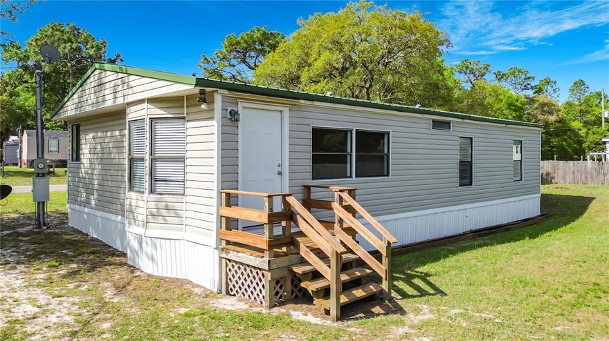 One or more photo(s) has been virtually staged. One or more photo(s) has been virtually staged.  Great opportunity to own an affordable home in Homosassa—perfect for a primary residence, vacation getaway, or investment! This 2-bedroom, 2-bath double wide sits on a corner lot and is move-in ready with some updates already in place, including a metal roof, newer A/C (approx. 1.5 years old), and brand-new carpeting in some of the rooms.

Inside, you’ll find a comfortable layout with spacious bedrooms, both featuring walk-in closets, and a primary suite with a private bath and step-in shower. This home offers a great opportunity to add your personal touches and make it your own.

Located just minutes from Hwy 19 for shopping and dining, and only a few miles from the Suncoast Parkway for easy access to Tampa. Enjoy being close to Homosassa’s boat ramps and endless outdoor activities like fishing, boating, scalloping, snorkeling, and swimming with manatees.