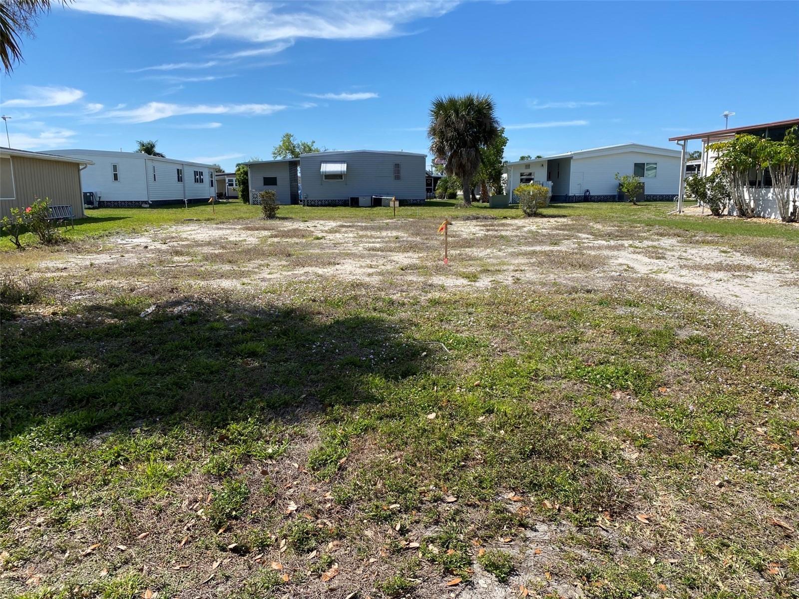 Vacant Lot with views of lake. Come join the ultimate lifestyle on Florida's Gulf Coast, located between Sarasota and Fort Myers with boat access to the Gulf. La Casa is a quiet 55+ community of 974 homes nestled among a variety of native trees. Spacious common grounds surround our eight lakes. Welcome To the Good Life! RECREATION, 2 Clubhouses, 2 Heated Pools. There is no shortage of activities in this community!