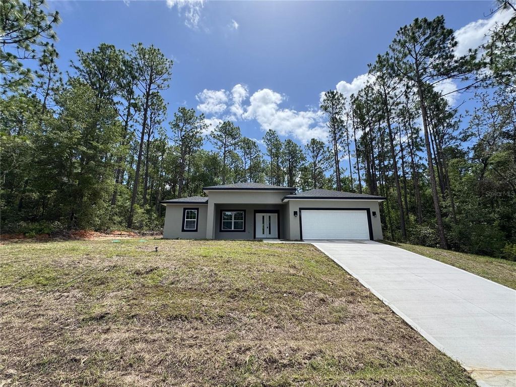 Photo of 7687 N Quibble Avenue, Dunnellon, FL 34434 (MLS # O6319774)