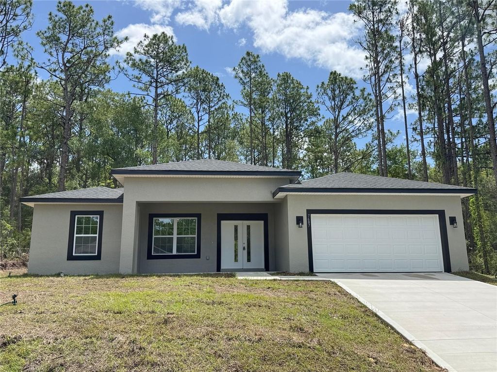 Photo of 7687 N Quibble Avenue, Dunnellon, FL 34434 (MLS # O6319774)