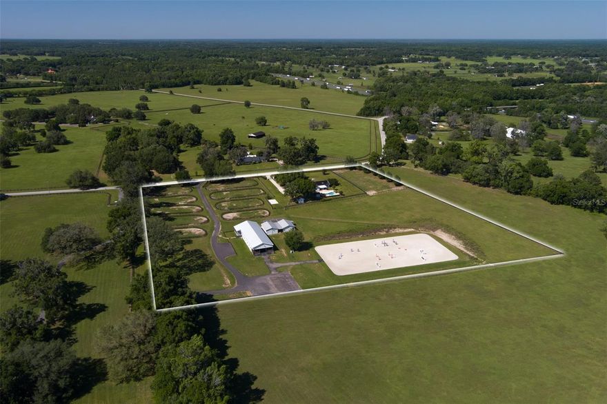 Don't let the size of this 10.25 acre farm fool you.  It is absolutely packed with amenities and located in a very recognizable area of NW Ocala's horse country, where horse farms, rolling hills, and granddaddy oaks fill the vistas!  This farm will provide you the privacy and serenity of rural country living, and yet is only 15 minutes to the World Equestrian Center!  To say this farm has undergone recent renovations is an understatement.  The lovely home was fully renovated and remodeled down to the studs.  It includes new wiring, lighting, flooring, appliances, and much more.  It is open and airy, and has a sleek modern country feel.  The lovely screened Florida Room overlooks the inviting pool and the pastures beyond; such a great place to relax and enjoy the expansive views.  The solar component of this home consists of a 16kWh unit with 44 panels, essentially producing enough energy to meet daily demands.   The 10-stall barn is a new addition to the farm, and includes 2 tack stalls, 2 wash stations with hot/cold water, a full bath, and laundry room.  It also includes an adorable 2 BR/2BA apartment with a screened porch.  There is also a 2-stall barn which has been updated with new wiring, lighting, matting, and new tack room, as well a large storage barn.  A new Wordley Martin 125' x 250' irrigated arena is just steps away; there are also two 50-amp and one 30-amp RV hookups. A full list of renovations and improvements can be found as an attachment to this listing.   This is the ultimate in Florida horse farm living and has income-producing potential as well.  Come take a look and see yourself and your horses in this first-class farm.