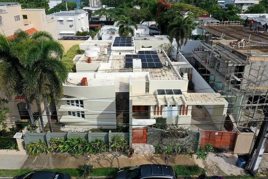 Live steps from the sand in Ocean Park, San Juan—a sun-splashed residence showcasing unique, modern architecture and warm natural finishes. Walls of windows and skylights bathe the open living and dining areas in abundant light, while custom millwork and a sculptural façade create a one-of-a-kind presence. The kitchen pairs stone accents with stainless appliances and an eat-in layout—perfect for easy gatherings before a beach day.

Designed for seamless indoor–outdoor living, wide doors open to a private courtyard with pool and spa, covered terrace, and service bar for effortless entertaining. Bedrooms are spacious and serene, offering retreat-like comfort. Everyday peace of mind comes with a full-house generator, cistern, and 24-hour community security.

In one of San Juan’s most sought-after coastal neighborhoods, you’re truly steps from the beach and minutes to cafés, restaurants, and vibrant city life—coastal style, comfort, and convenience in perfect balance.