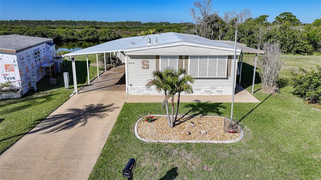 Photo of 554 Parkwood Avenue, North Port, FL 34287 (MLS # C7523838)