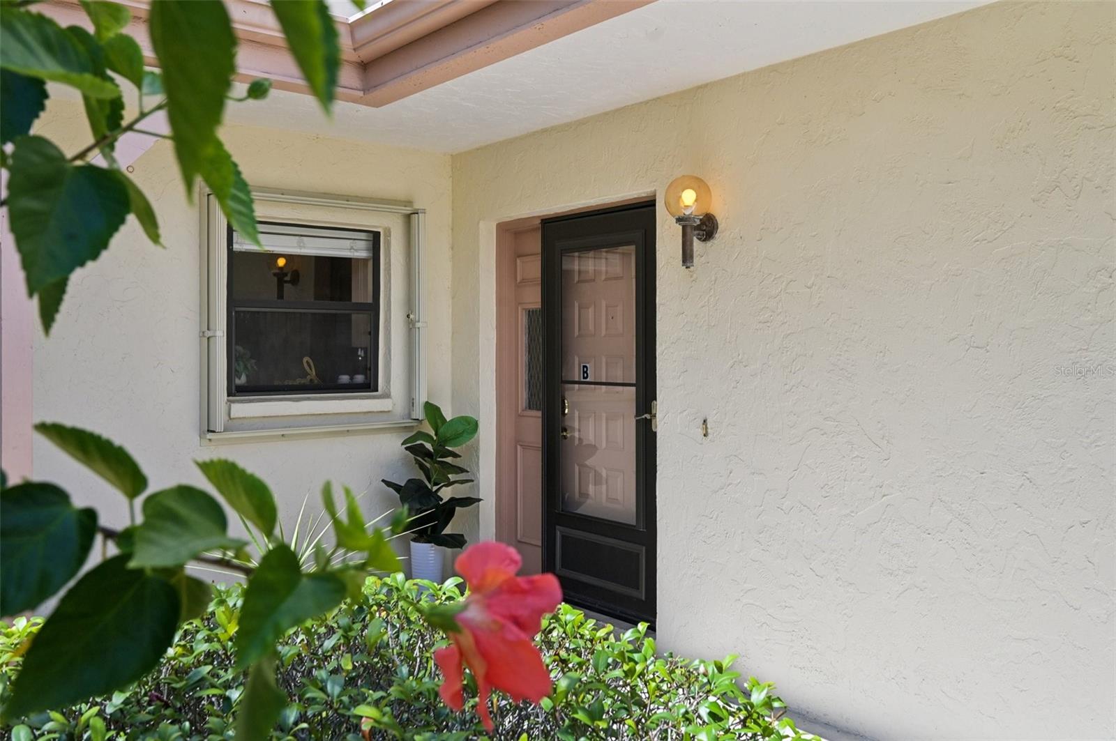 Welcome to your serene slice of paradise in beautiful Venice, Florida! This delightful 2-bedroom, 2-bathroom first-floor end unit condo is perfectly positioned on the peaceful Claw Lake, offering picturesque water views from your kitchen and living room. Enjoy your morning coffee while watching the wildlife or unwind in the evening with a cotton candy sunset from your enclosed patio —true Florida living at its finest.
Step inside to discover modern luxury vinyl plank (LVP) flooring and neutral interior paint that creates an inviting atmosphere throughout. The spacious open layout makes everyday living and entertaining a breeze. The thoughtful layout includes a large primary bedroom with ensuite bathroom and two closets. The secondary bedroom has it's own bathroom allowing privacy for guests. Inside laundry boasts two front load machines and extra shelving for storage. Villa Nova shores is a quaint community minutes from Venice Beach, Sarasota Memorial Hospital, waterfront dining, boating marinas and Historic Downtown Venice. Perfect for year-round living or a seasonal escape!