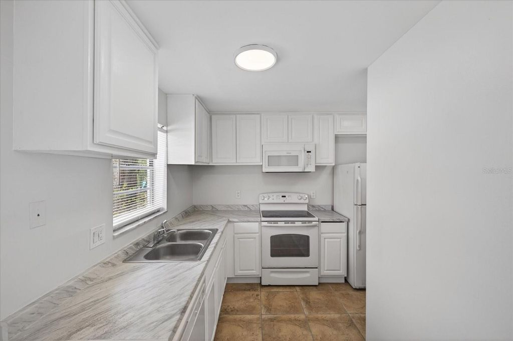 Photo of 14024 Village Terrace Drive, Tampa, FL 33624 (MLS # TB8510273)