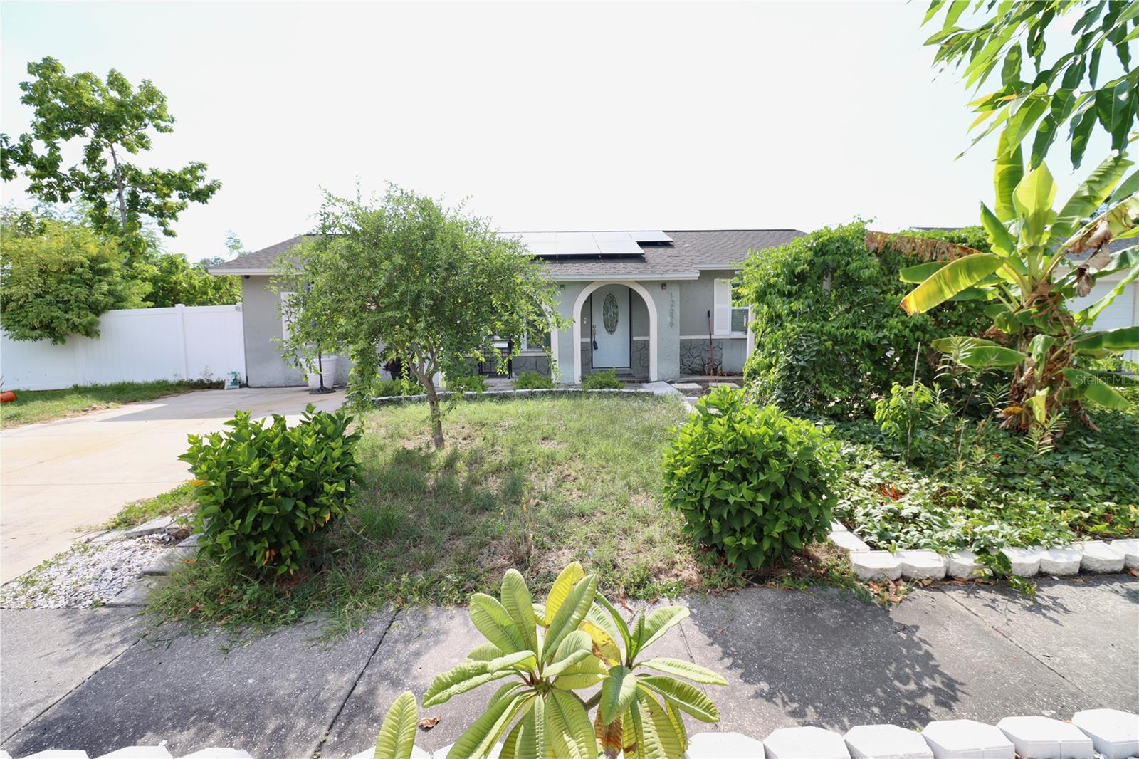 Large corner fenced in lot comes with all your outdoors needs. Fiberglass salt water pool that's fun for the whole family. Solar panels to save on your electric bill and a House that needs TLC. The house was fully upgraded in 2017 with the roof being approximately from 2011, the A/C is from 2017, the tankless water heater is from 2019, and a water softener for the whole house. This 3 bedroom 2 bathroom just needs a green thumb to make the large fenced in yard home. Kitchen has granite counter tops and stainless steel appliances with a nice size pantry. The over-sized Master bedroom with its own private bathroom comes with new 2022 stackable front loader washer and dryer. Bonus room can be used as second living room and dining room combination. The Fiberglass pool is nice and refreshing for hot summer days. The Fenced in Backyard is your oasis blank page to have a garden and plenty of room for back yard fun with family. Centrally located to the hospital, restaurants, and shops and 20 minutes away from IRB.