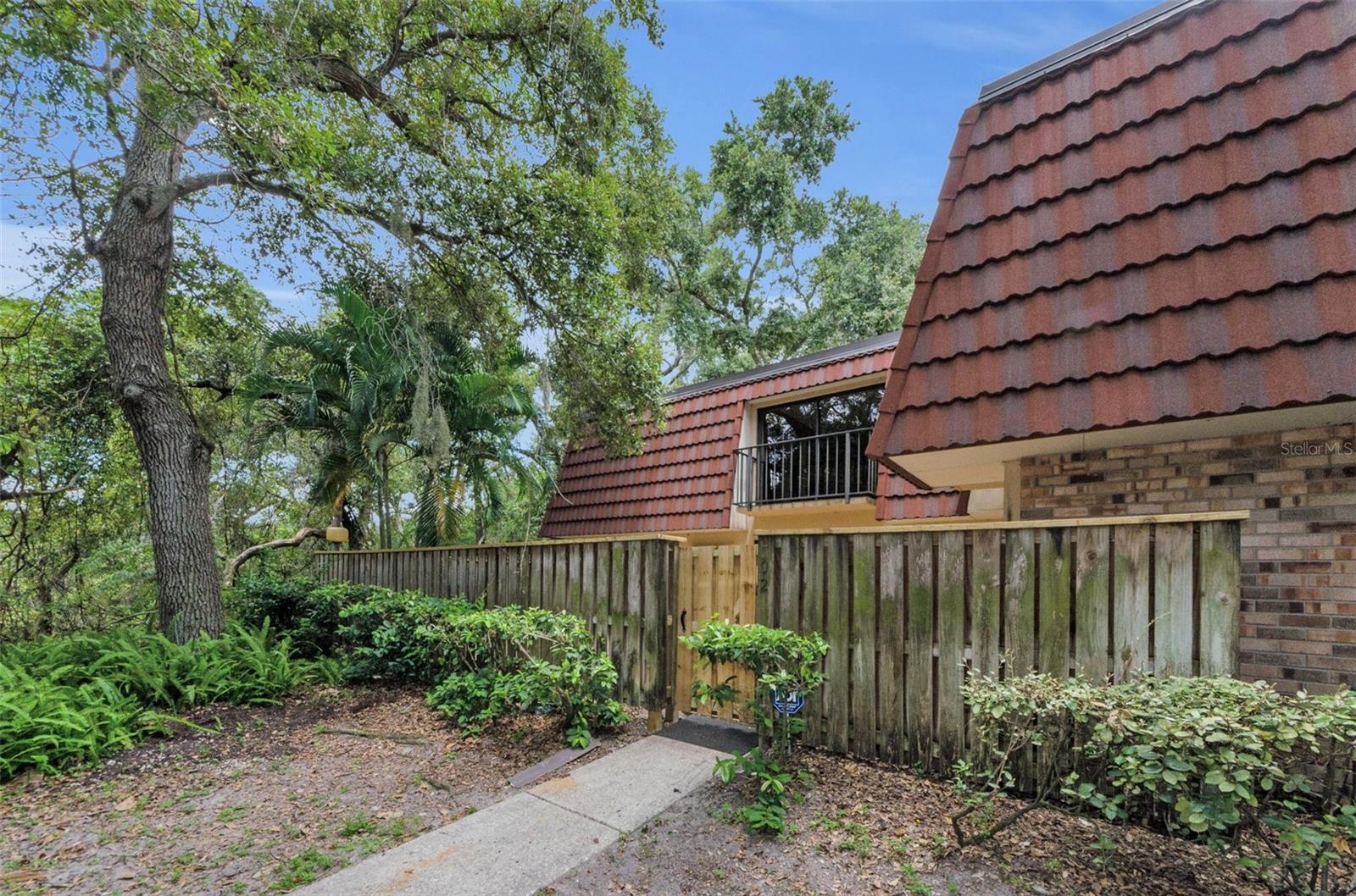 Location, Location, Location! Highly desirable Townhome located in Wedge Wood of Palm Harbor, located off US 19 between Curlew and Tampa Rd with top rated schools, minutes away from World Famous Beaches- Honeymoon Beach and award-winning Clearwater Beach, all the best restaurants and close to multiple shopping stores/countryside mall! This Awesome 3-Bedroom, 2 1/2 Bath, Townhome has a beautiful, updated kitchen with newer cabinetry, quartz counter tops and stainless appliances! Downstairs offers a large family room area, dining room, kitchen, 3rd bedroom, laundry and a half bath. Up the stairs to the second floor where you will find Bedroom 2 and Hall bath and a large master bedroom suite offering a beautiful, updated master bath! Both of the bedrooms upstairs have a small balcony overlooking the huge patio/lanai area. Live in your own park-like community with beautiful, shaded tree lined streets that will greet you as you enter the complex. Each unit is very private with its own 25 x 17 fenced in patio for family gatherings. The community has many amenities including a large Heated Saltwater Pool, Hot Tub, Tennis Courts, Basketball Courts, Playground and a beautiful lake and is located just minutes from all Shops, Services and Great Local Pinellas Restaurants!!! The monthly maintenance fee includes trash, exterior maintenance, grounds maintenance, management, pool maintenance, recreational facilities maintenance, and Roof. Come see for yourself how beautiful and peaceful this community is!