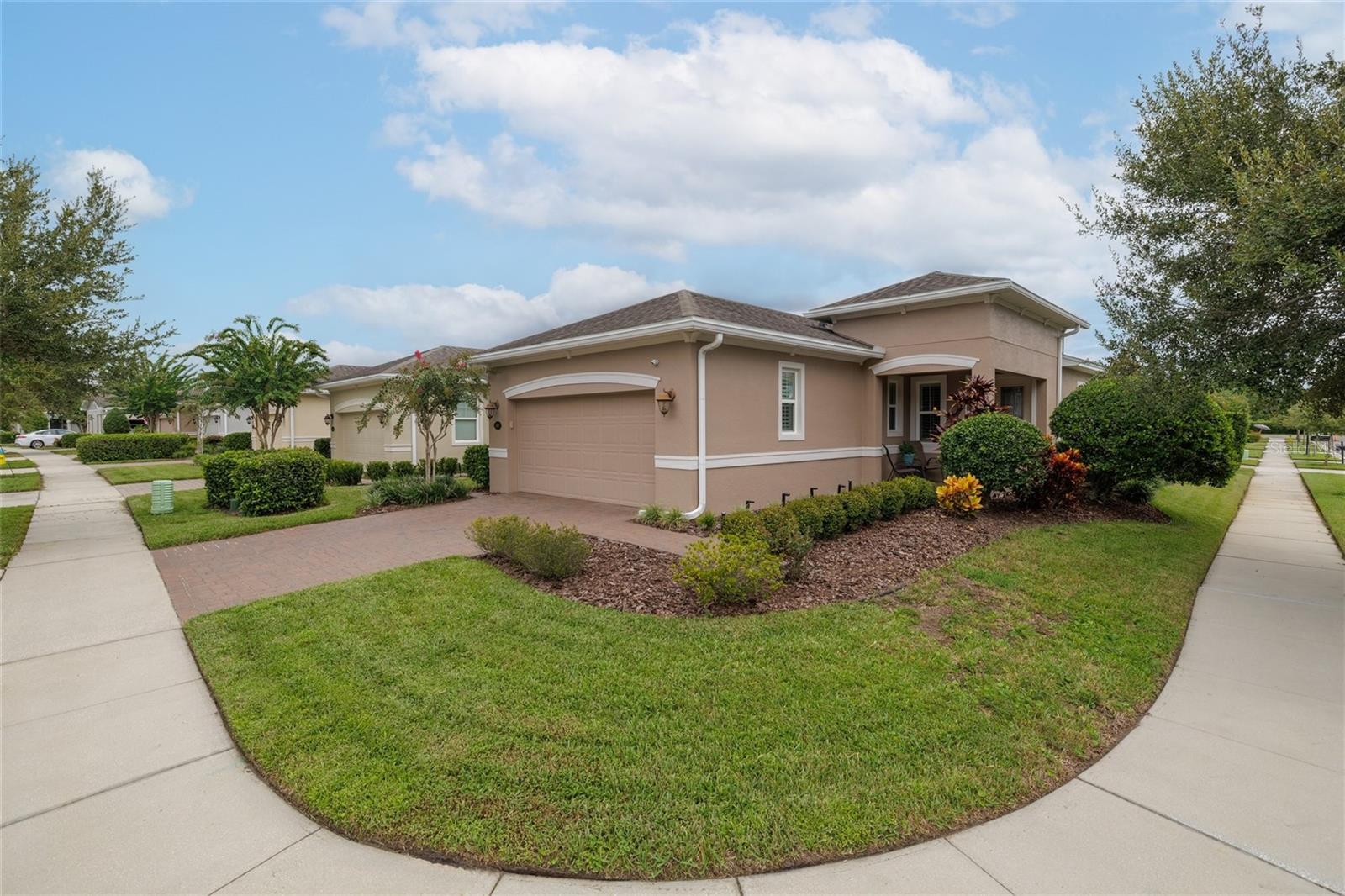 Escape to your Florida dream home in the impeccable Victoria Gardens/Cresswind community! Enjoy the best of the Sunshine State in this luxurious, move-in ready 2 bedroom, 2 bathroom plus Office/Den Azalea home. Tile flooring and Luxury Laminate are some of the beautiful features of this Light & Bright perfect home. Corner homesite with Lush Landscaping ~ Create delicious meals in the chef-designed kitchen – complete with 42"cabinets, pendant lighting, breakfast bar, tile backsplash, New Refrigerator, Stainless Steel appliances and a walk-in pantry. All appliances stay including Front load Washer / Dryer, Tankless Hot Water Heater, and Water Softener. This well-appointed residence also boasts of Plantation Blinds on all DOUBLE PANE windows. Ceiling fans, a Leaded-glass front door, Paver patio and driveway. Inside laundry room. Kingsized owners suite, with 2 walk-in closets and a spacious en suite bathroom featuring a walk-in shower and private water closet. Entertain your guests outdoors on your 28x10 screened lanai, surrounded by a high privacy hedge. As a resident of this Active 50+gated community, you will enjoy the finest in amenities, including your very own Private clubhouse, dining, bar, game rooms, fitness room, a resort-style pool, lighted tennis and pickle ball courts, bocce ball, library, crafts, and travel clubs and live entertainment. Just minutes to the historical downtown DeLand voted 'Best Small Town' with its exquisite restaurants, night life, boutiques, and cultural attractions. HOA includes: TOTAL lawn & shrub care, Cable TV, with DVR, High-speed internet, reclaimed water irrigation and access to all community amenities. This great location is Home to Stetson University. Only a short drive to the beautiful East Coast beaches, Daytona or New Smyrna Beach! Publix, Aldi, Starbucks, and medical facilities are all nearby, as well as easy access to I-4, making this the perfect place to call home! Call today to schedule your private tour!
