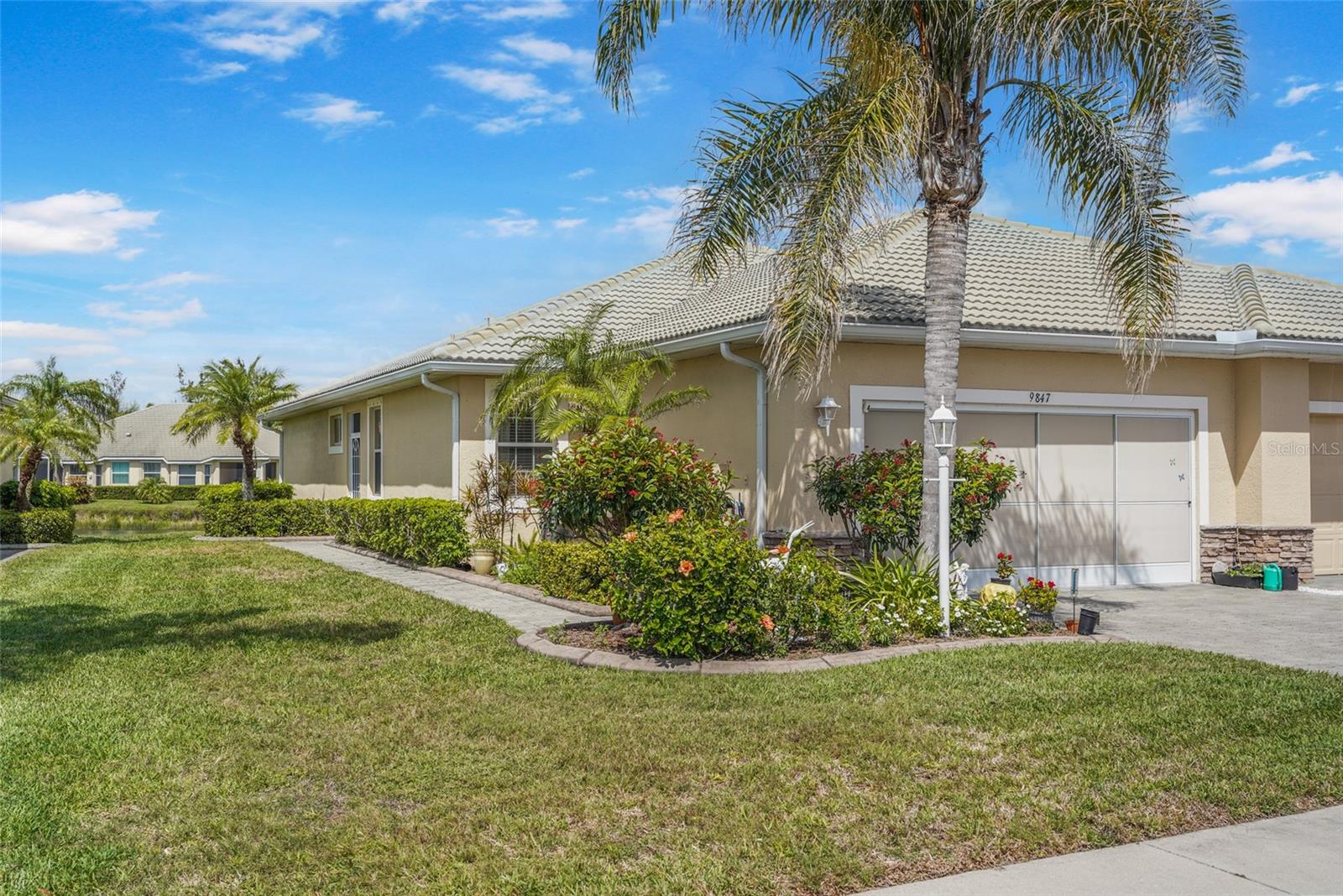 Located in the desirable gated community of Talon Bay, 9847 Hawk Nest Ln offers a beautifully maintained and fully furnished retreat with stunning water views. This meticulously cared-for 2-bedroom, 2-bathroom home with a versatile office/den is designed for both comfort and style. The inviting open layout features tile flooring throughout the main living areas, while the beautifully appointed kitchen boasts granite countertops, a brand-new stove, fridge, and high-end Bosch dishwasher. A conveniently located laundry room off the kitchen provides extra storage and new washer and dryer. The spacious primary suite is a private oasis, featuring luxury vinyl plank (LVP) flooring, elegant plantation shutters, two generous walk-in closets, and an en-suite bath. The thoughtfully designed second bedroom also showcases LVP flooring and a space-saving Murphy bed, making it ideal for guests while allowing for flexible use when unoccupied. Go outside and relax on the screened-in lanai, where you can gently rock in the rocking chairs while taking in the peaceful water views. The HOA takes maintains the grass, shrubs and exterior of the villa. Cable is also included. Talon Bay elevates your lifestyle with resort-style amenities, including a heated pool, fitness center, tennis courts, kayak launch, and a stunning clubhouse. Ideally situated between Sarasota and Fort Myers, this home is just minutes from the rejuvenating Warm Mineral Springs, an array of shopping and dining options, and a short drive to the pristine Gulf Coast beaches—offering the perfect blend of relaxation and convenience.