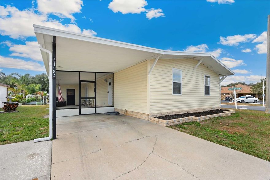 Welcome to 3125 Briar Street in Timberlake Estates!  If sunny Florida living is calling your name, this beautifully renovated 3-bedroom, 2-bath home on a prime corner lot near the community pool is one you won’t want to miss. With stylish upgrades throughout and thoughtful design, this home offers a perfect blend of comfort, function, and modern appeal for buyers of all ages.  From the moment you arrive, you’ll notice the double driveway, the huge attached screen room as well as the new vinyl siding.  But when you step inside you will find an open, airy floor plan featuring luxury vinyl plank flooring throughout and a bright, contemporary kitchen that truly shines. The kitchen boasts white mission-style shaker cabinetry, butcher block countertops, stainless steel and black appliances, a center island with cooktop and range hood, a wall oven, a pantry closet, and a cozy breakfast bar—ideal for casual dining and entertaining.  The spacious living room features vaulted ceilings and easily accommodate a large sectional or multiple couches if needed, creating a welcoming space to relax or host guests. The adjacent dining area, also off the kitchen, offers flexibility for a larger table if desired.  The private primary suite spans the back of the home and includes a generous walk-in closet and room for a king-size bed. The ensuite bath is a standout with a stylish new gray vanity and an oversized walk-in shower with frosted glass doors. The two guest bedrooms and a full bath are located on the opposite side of the home, providing privacy and comfort. Both bedrooms are freshly painted and are large enough for queen-size beds.  Additional interior features include new light fixtures, inside laundry, and new double-pane tilt-in windows with new blinds.  Outside, enjoy Florida living year-round in the oversized screened Florida room, perfect for morning coffee or evening breezes. Major updates include a 2024 A/C unit, a 2025 metal roof, and a 12 x 12 attached storage room for extra convenience.  Timberlake Estates is a gated, non-age-restricted community offering an active and welcoming lifestyle with two resort-style pools, a hot tub, fishing pier, and a vibrant clubhouse featuring a library and billiards room. Ideally located near the expanded Wiregrass Town Center, along with shopping, dining, grocery stores, and convenient access to I-75, this community combines comfort with convenience. The low monthly fee of $217 includes water, sewer, trash removal, lawn care, and full use of community amenities. Golf-cart friendly and thoughtfully designed, Timberlake Estates also offers RV and boat parking/storage for a nominal fee, making it perfect for those who enjoy both relaxation and adventure.  3125 Briar is move-in ready, thoughtfully updated and is being sold furnished.  Schedule your private showing today so you can enjoy modern Florida living!!