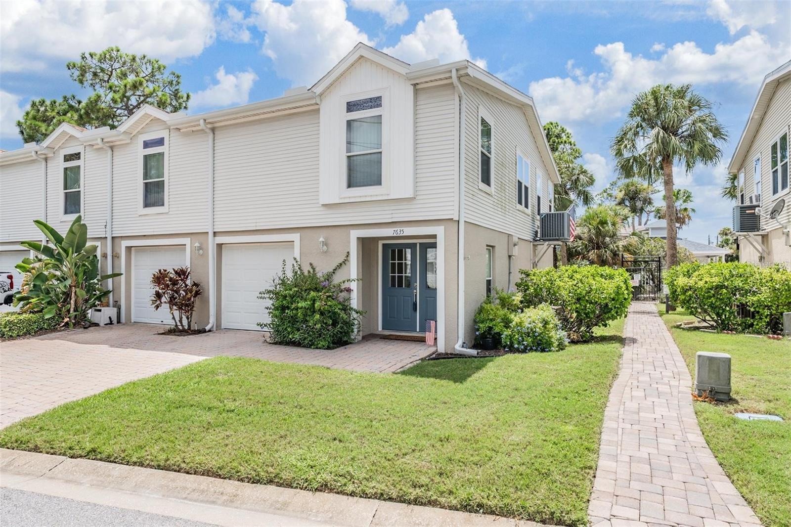 Welcome to 7635 Sailwinds Pass, a beautifully updated two-story townhouse nestled in the desirable Marina Palms community of Port Richey. This spacious 3-bedroom, 2-bath home offers a smart blend of comfort, functionality, and style — perfect for modern Florida living.
Step inside through the elegant double-door front entry and immediately notice the soaring cathedral ceilings, crown molding, and tray ceilings that create a sense of grandeur. The open-concept living and dining area is complemented by surround sound, custom built-ins, and stylish window treatments, offering both sophistication and comfort. The heart of the home—the kitchen—has been recently upgraded with new stainless steel appliances, shaker cabinets, a custom backsplash, pantry, laminate countertops, and a convenient breakfast bar—ideal for casual meals or entertaining. Upstairs, the primary suite provides a relaxing retreat with a seamless shower stall, bathtub, walk-in closet, and owner’s retreat touches throughout. The thoughtful split-bedroom layout ensures privacy for everyone. Energy efficiency and comfort go hand in hand here, with additional insulation, a new HVAC system, newer roof, and upgraded features like a video doorbell, smoke detector, and irrigation system. Outside, enjoy Florida’s sunny lifestyle on your balcony, covered front porch, or the paver-lined deck and walkways. The oversized driveway, garage workshop, and garage door opener add convenience and versatility. Community amenities include a standard pool, spa/hot tub, and a peaceful residential setting. This home offers not just space—but smart, stylish, and efficient living in a well-kept, amenity-rich neighborhood. Don’t miss your opportunity to own this stunning home—schedule your private tour today!