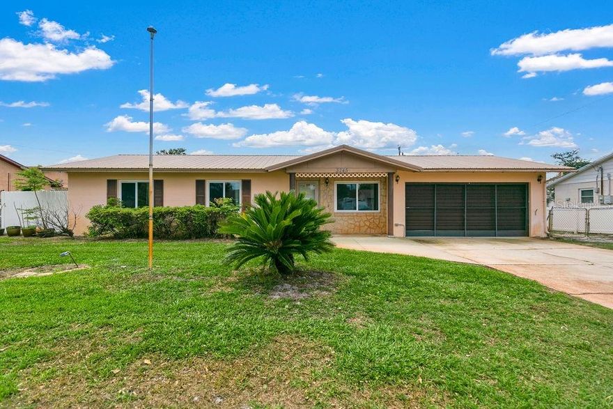 Concrete block 3 bedrooms, 1.5 bath home with a 2-car garage and NO HOA. Long-time family owned with major updates including metal roof, new ductwork & HVAC (2025), updated plumbing, electrical panel (2015), and impact-rated windows on most of the home. Features include a 23×11 Florida Room, fully fenced yard with a double gate, 10×10 shed with electric, 20×11 metal shed, and private well. Conveniently located near dining, shopping, vehicle services, gyms, beauty and just 2.5 miles to I-95. All big-ticket items are done—ready for your finishing touches!