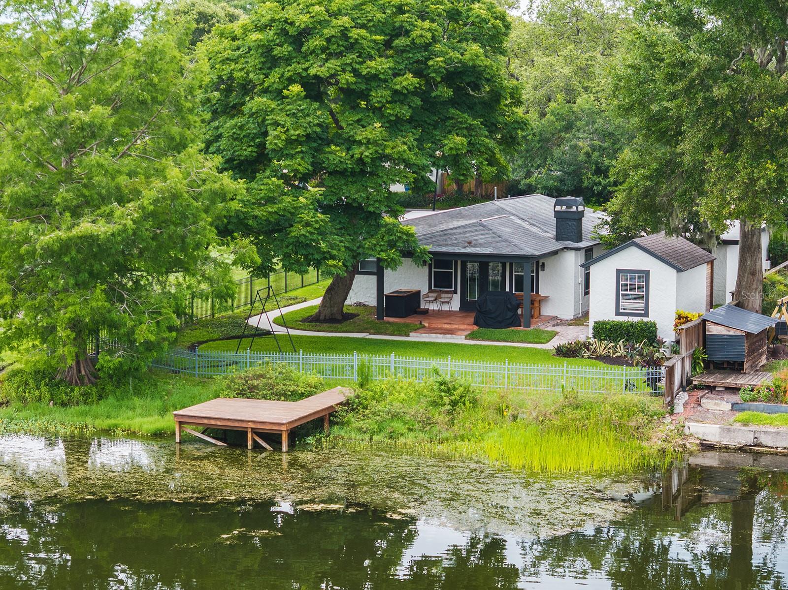 Zoned for Audubon K-8 and Winter Park High. Move in just in time for the school year!! Single-story LAKEFRONT gem in Winter Park! This beautifully renovated mid-century home sits on an oversized waterfront lot minutes from downtown Winter Park, Audubon Park, and Baldwin Park. Enjoy access to top public and private schools. Step into nearly 2,200 square feet of beautifully maintained living space. Your home features a thoughtful split-bedroom floor-plan with formal living and dining rooms, a spacious family room with wood-burning fireplace, and elegant touches like hardwood floors, crown molding, and detailed woodwork throughout. The updated kitchen is a standout with granite countertops, a glass tile backsplash, stainless steel appliances and a versatile dry bar/coffee station. Large windows and French doors in the family room fill the home with natural light and open to a covered patio with sweeping views of the manicured backyard and tranquil lake. The primary suite offers a peaceful retreat with a walk-in closet and private en suite bath, while two generously sized guest rooms share a stylish hall bath featuring a vintage clawfoot tub. With 70 feet of waterfront, a newer dock, and space for kayaks or paddle-boards, this home delivers year-round outdoor living. An outdoor private sauna for your enjoyment and large storage shed offers flexible use for a workshop, studio, or extra gear. Also equipped with brand new HVAC system and Reverse Osmosis Whole-Home Water Filtration System. Rare opportunity to lease a low-maintenance lakefront residence in one of Orlando’s most desirable neighborhoods! Schedule your private tour today.