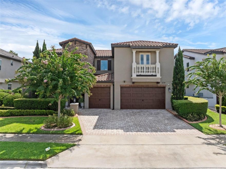 UPGRADES GALORE in this Award Winning Delray Model, MOVE-IN-READY! This Pool Estate offers a rare opportunity to indulge in luxury living. The two-story home boasts 4,409 square feet of living area with five bedrooms, five bathrooms, two half-bathrooms, and a three-car garage. (It's 5,844 square feet, counting the garage, front entry, lanai, and rear balcony.) Exquisite finishes, Italian Architecture, a second-floor balcony, a 2-story foyer, a Juliette balcony, and a magnificent Chef's kitchen are just a few of the features that will have you upon entry. The amazing kitchen is truly the heart of the home and features 42" cabinetry with second-tier upper lighted hutch stack for even more storage space, soft close doors and drawers, over and under ambient lighting, and crown molding. The cabinet-front door to the pantry eloquently blends with the cabinetry and upgraded Jenn-Air appliances. KitchenAid Double Oven.  The oversized prep island has a sink, and there is a convenient pot filler water faucet on the gas cooktop wall. There is a fabulous 200-bottle wine cellar nestled under the stairs with wine refrigeration/storage and wrought iron-gated entry. The MAIN FLOOR master suite is both spacious and private and features a luxurious walk-in shower, free-standing soaking tub, and walk-in closet. There is an additional guest bedroom with an en-suite bath on the main floor, great for guests or in-laws. Upstairs, you will enter the large gathering room with rich wood floors, tray ceiling, and a built-in desk which opens up to a 22-foot second-floor balcony. There is a theatre room jhas  Epson projector with a HEOS sound system that connects to Indoor and outdoor and rock speakers. Upstairs three additional en-suite bedrooms, one being designed as a "second master suite". The spacious, covered lanai is enclosed with 3-panel stacking slider doors, creating an expanded and open outdoor living space. The lanai includes a summer kitchen, a large pool with spa. Canopy Oaks is a gated enclave of luxury homes in Winter Garden. !Reading nook with built in book shelves
Canopy Oaks, located in Winter Garden, Florida, is a unique blend of high-end luxury homes and suburban tranquility. This gated enclave, developed by the distinguished home builder A.R. Bailey, features 49 classic estates, each meticulously crafted to cater to the specific needs and desires of homeowners, includes scenic nature trail, a children’s play park and a community post office. 

An exceptional estate at an exceptional value
Canopy Oaks is located on Roper Road between Winter Garden’s downtown historic district and the Winter Garden Village shopping complex. With convenient access to major highways such as 429, 408, and the turnpike, as well as its proximity to world-renowned attractions like Disney World® and Universal Studios®, this home presents an exceptional opportunity for easy commuting.