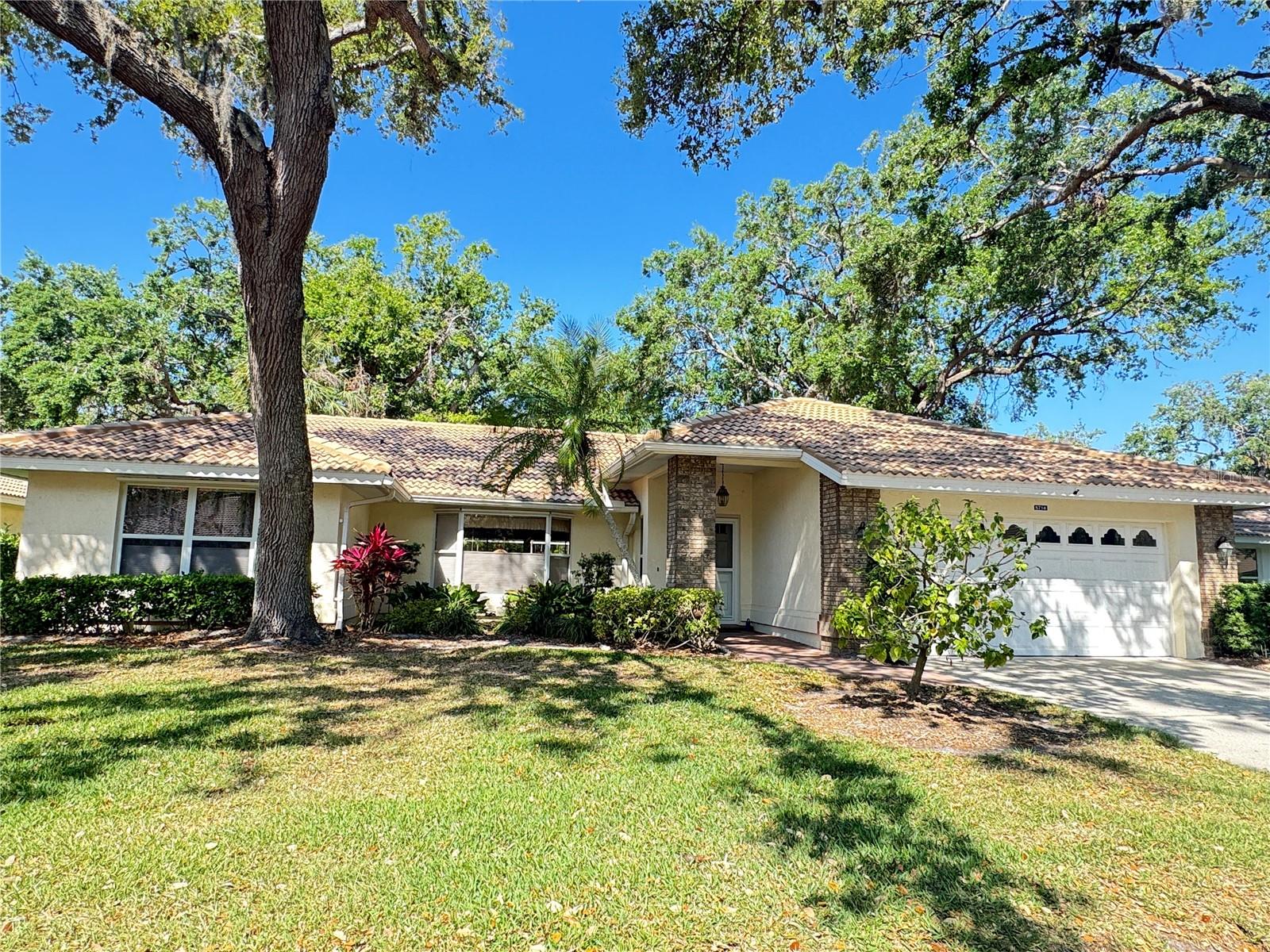 Step into the Florida vacation lifestyle in this beautifully updated home, nestled within the gated, resort-style community of Garden Lakes. Move-in ready and freshly painted, this inviting home features neutral tile throughout and a thoughtfully designed split floor plan that maximizes comfort, privacy, and convenience.
The spacious living and dining area is perfect for both relaxation and entertaining, seamlessly flowing into the air-conditioned Florida room. From there, enjoy tranquil views of the oversized screened lanai and the serene natural backdrop beyond.
The kitchen features beautiful updated cabinetry, gleaming quartz countertops, and newer appliances. A cozy breakfast nook overlooks the lanai and backyard, creating the perfect spot to start your day with coffee and sunshine. Storage is no issue here, with abundant cabinets, abundant drawers, and a large walk-in pantry/laundry room to keep everything organized.
You'll enjoy coming home to the spacious master suite, complete with dual closets and a beautifully renovated bathroom featuring a new vanity, sink, and a luxurious no-threshold shower with elegant stone-look tile. The home also offers generous storage, including ample closet space and a well-appointed garage.
Outdoor living is a dream with the expansive screened courtyard—ideal for hosting dinner parties or simply unwinding with a good book and a refreshing drink while taking in the peaceful surroundings. Plus, if you’re interested, the stylish home furnishings are available as a separate option.
Beyond your doorstep, Garden Lakes offers an unbeatable lifestyle with winding walking paths shaded by majestic oaks, a recently updated clubhouse, and a wealth of activities. Stay active with tennis, pickleball, shuffleboard, fitness classes, and water aerobics, or join community groups for arts & crafts, cards, and social gatherings. The heated pool invites you to take a leisurely swim or just float and relax under the Florida sun.
Conveniently located near top shopping, dining, medical facilities, golf courses, and entertainment, this charming community offers both tranquility and easy access to everything you need. Don't miss your chance to call this exceptional home yours—schedule your showing today!