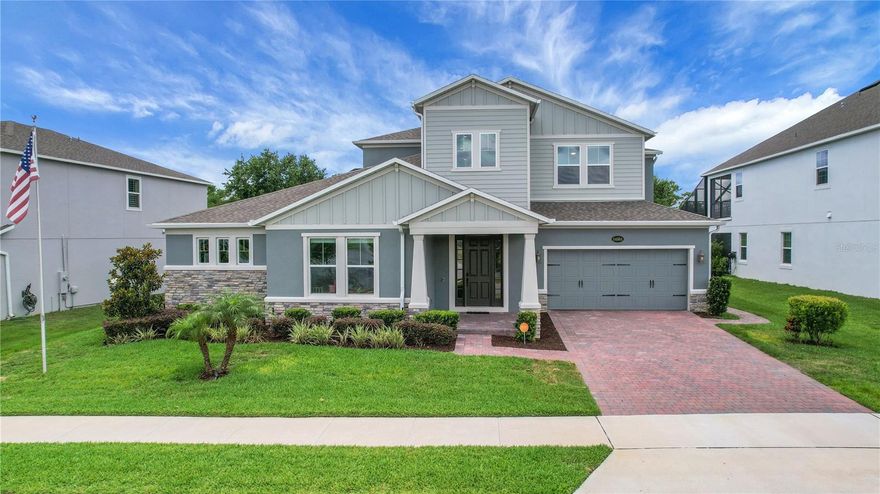 Welcome to this 5-bedroom, 4.5-bath home offering 4,030 sq ft of living space in the gated community of Tilden Place. Upon entry, you’re greeted by views of a grotto waterfall (2025) that conceals a private spa, creating a true backyard retreat. The open layout features granite countertops, a large waterfall-edge island, and glass backsplash in the kitchen, perfect for entertaining. The main floor includes the primary suite and a secondary bedroom with private en suite. Upstairs offers a spacious bonus room and three additional bedrooms, all with walk-in closets, including one with its own en suite. The garage is equipped with an electric EV charger for added convenience. Enjoy a resort-style pool with waterslide, mini lazy river, outdoor kitchen, and pool half bath, all enclosed within a panoramic lanai. With no rear neighbors and conservation views, this home offers added privacy while being conveniently located near Winter Garden shopping, SR 429, and Disney attractions. Schedule your showing today.