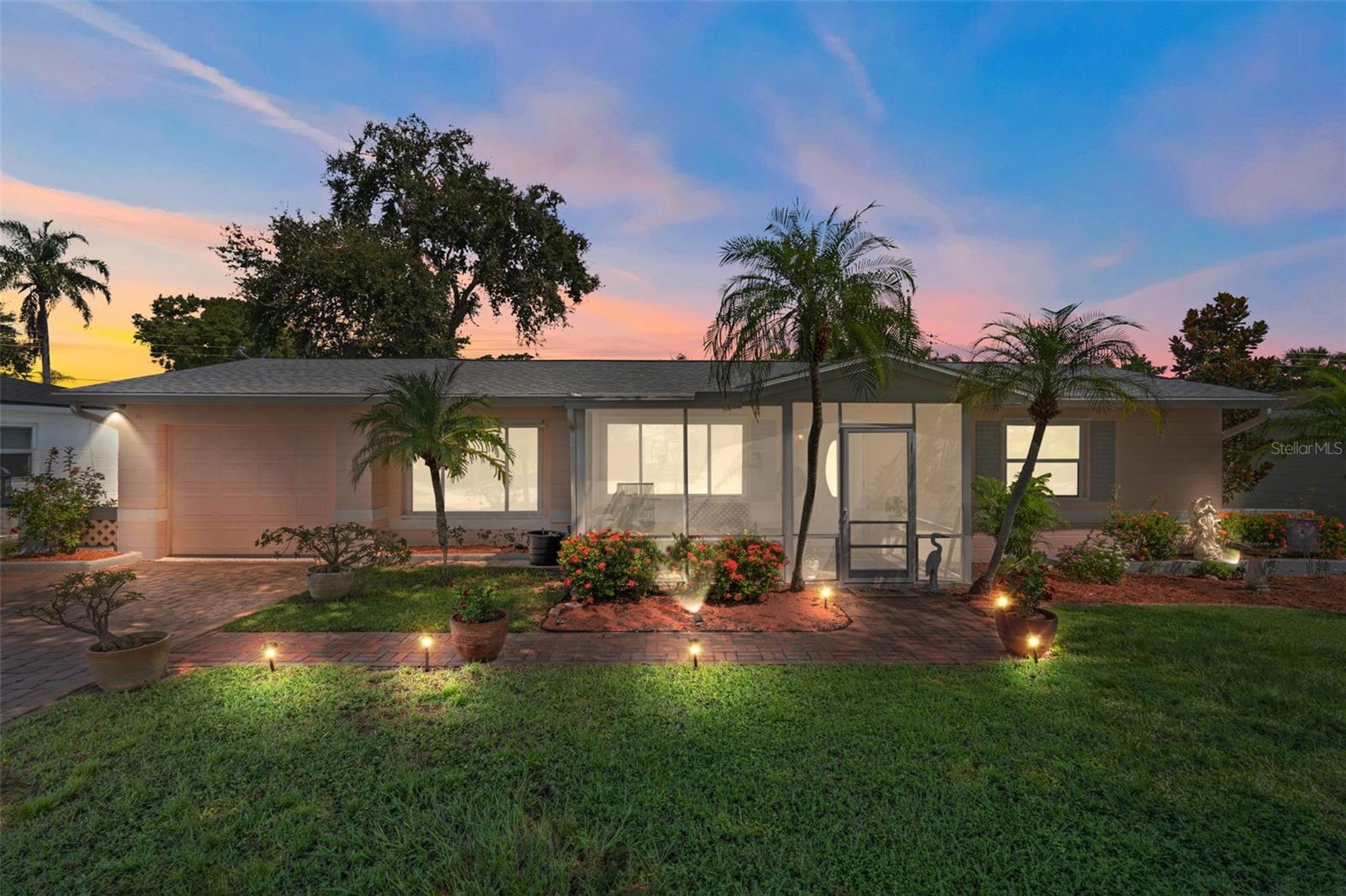 Absolute Perfection in Kenneth City!
Welcome to this stunningly updated 3-bedroom, 2-bathroom, split floor plan home with a 1-car garage, perfectly situated high and dry in a non-flood zone. With extensive renovations completed in 2023 and 2025, this home is truly move-in ready and designed for modern living. Recent Updates Include: New Roof (2023) New Flooring (2025) New HVAC System (2025) New Water Heater (2025) New Water Softener System (2025) New Kitchen Counters, cooktop, dishwasher (2025) New Guest Bathroom (2025) New Epoxy Garage Floor (2025) Newer Paver Driveway. Step inside to discover a spacious primary suite featuring a large walk-in closet, luxurious en suite bathroom with a jacuzzi-style tub and separate walk-in shower. French doors open to a large, screened-in deluxe porch, ideal for relaxing or entertaining year-round. The private, well-maintained backyard offers peace and tranquility—perfect for enjoying Florida’s beautiful evenings. The Irrigation system keeps the entire property looking beautiful. Kenneth City offers a friendly small-town vibe while being close to everything: Just 15 minutes to the beaches, Near popular shopping, dining, and entertainment, Easy access to I-275, Convenient to Clearwater International and Tampa International Airports. Don’t miss the opportunity to own this impeccably upgraded home in one of the area's most desirable locations. Schedule your private showing today!