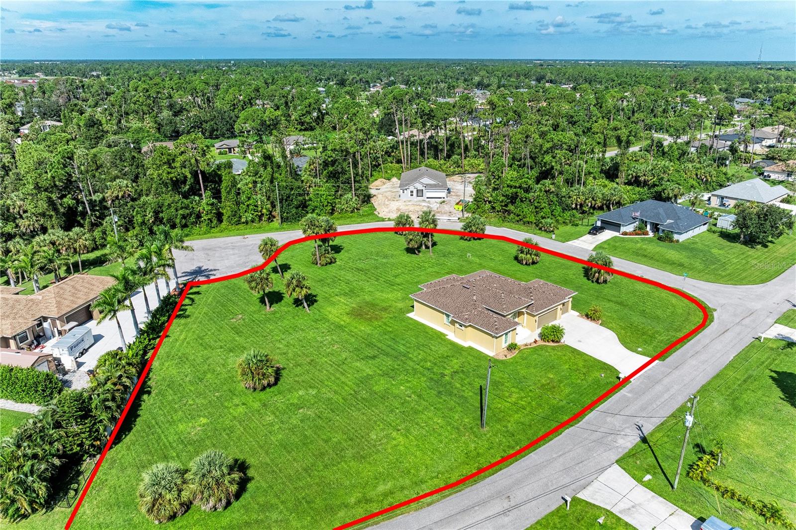 One or more photo(s) has been virtually staged. A Modern Retreat on a Rare 1-Acre Corner Lot
Step into comfort, style, and peace of mind with this beautifully designed 3-bedroom, 2-bathroom + den home, built in 2019 and located on a spacious 1-acre corner lot outside the flood zone. From the moment you arrive, you’ll notice the meticulous attention to detail and quality craftsmanship throughout the property.
The home features 10-foot ceilings, coffered and tray ceilings with crown molding, and arched windows that add architectural character and natural light. Wood-look porcelain tile runs throughout the entire home, offering both elegance and durability.
The kitchen is both stylish and functional, featuring a Whirlpool fingerprint-resistant stainless appliance package (including a convection air-fry range), granite countertops, a tiled backsplash, and plantation shutters that tie the space together with charm.
The living area showcases a coffered ceiling with crown molding and is finished with matching plantation shutters, creating a polished and welcoming space for relaxation or entertaining.
The primary suite is a peaceful retreat with a coffered ceiling, his-and-hers walk-in closets, and a spa-like en-suite bathroom featuring granite counters, a linen closet, and plantation shutters for added privacy.
Designed with comfort and practicality in mind, the home also includes a 3-car garage with epoxy floors, 200-amp electrical service, upgraded accordion hurricane shutters, and a cement walkway that wraps around the entire property for ease of access and maintenance.
Step outside to enjoy Florida’s year-round sunshine in your extended under-roof lanai, ideal for outdoor dining or lounging in total privacy. The professionally landscaped yard includes decorative curbing with stone accents, a Wi-Fi-controlled irrigation system, and plenty of space to add a pool, detached garage, or garden oasis.
Other smart home features include a Ring security system and Wi-Fi-enabled garage door controls for peace of mind wherever you are.
Located in the growing city of North Port, this home places you close to natural attractions like Warm Mineral Springs, Myakkahatchee Creek Environmental Park, and endless opportunities for kayaking, hiking, and fishing. You'll also be just a short drive from CoolToday Park, Atwater Community Park, and the waterfront shops and dining of Wellen Park. The Gulf Coast's stunning beaches are also within easy reach.
If you're looking for a move-in ready home with timeless style, smart upgrades, and plenty of room to grow this is it.