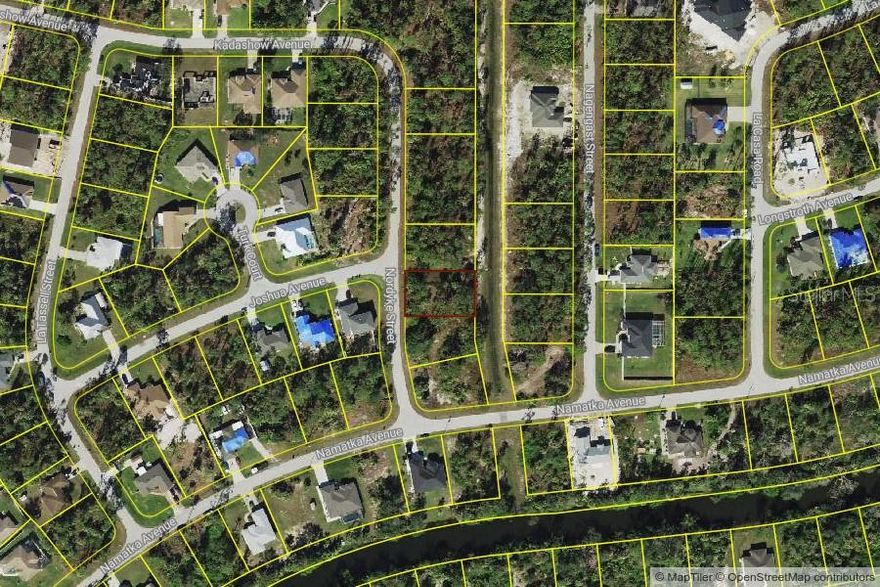 Beautiful lot waiting for you to build your dream home in the thriving city of North Port. The lot is backed up to a greenbelt, giving you extra privacy. North Port is home of the Atlanta Braves Spring Training. Minutes to the North Port Aquatic Center, the water park that features a 25-meter stretch pool, three slides, and a lazy river. Centrally located to EVERYTHING...US-41, I-75, schools, Suncoast Technical College, Shannon Staub Library, and plenty of grocery & retail shopping, and dining. Close to Venice, Port Charlotte & Punta Gorda. Convenient access to a multitude of golf courses, world-class fishing, boating, and stunning Gulf beaches!