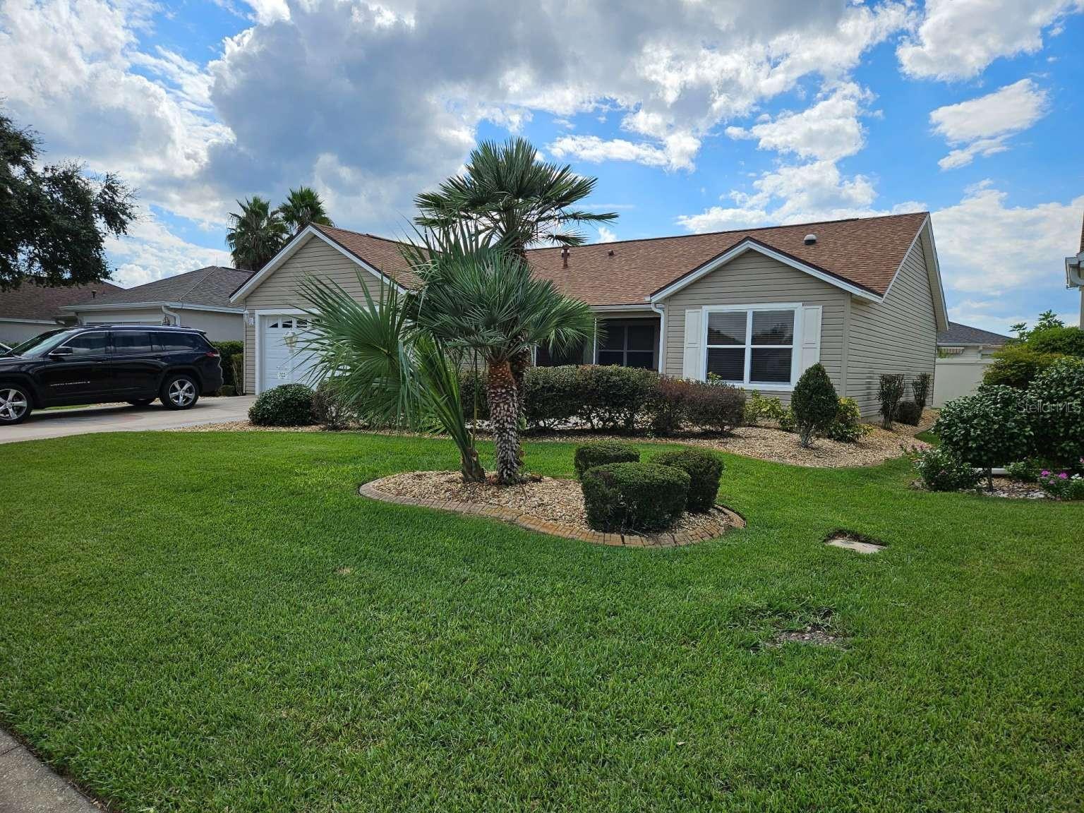 Designer Bougainvillea Split Floorplan Home is Located in the highly desirable Village of Winifred. Minutes to Palmer Legends Championship Course, Palmer Country club and less then 10 minutes from Sumter Landing. This Remodeled Updated Ready to Move in, 3 bedroom, 2 bathroom split Bedroom and Open floor plan with Vaulted Ceiling and many upgrade features Granite Kitchen and Baths, Upgraded stainless kitchen with French door refrigerator, Dishwasher, Gas Stove with convection/ air fry oven, microwave overhead, garbage disposal Wood Like Porcelain Tile Flooring Thru-out, Split floorplan with master opposite side of house and includes a separation door from living area on opposite side of house to close off guest bedrooms and bath, Master Bedroom has 2 walk in closets and bath with dual granite top sinks, walk in shower and privacy toilet. Front Screened Porch Rear Enclosed Sunroom with Slider Windows AC/Heat, Roller Blinds. Hard to find Privacy Wall behind house Furniture etc. available extra No Bond Remodeled Updated 2023 New Roof 4/2020 New HVAC 7/2016 Hot Tub with lid Stainless Steel Gas Grille Large Attic with stairs, Floor Storage Sealed Decorative Driveway Industrial Epoxy Garage Floor LP Gas Tankless Water Heater Whole House Water Filter and Softener System 3- Solar Tube Lights Lightning Spike Meter Protection Updated Landscaping Current Termite Contract Close to Lake Sumter Landing, Southern Trace, Laurel Manor, Polo Fields, Shopping, Dining, Doctors, more. Easy access to golf cart paths and Less than 15 minutes to Walmart, Publix, Fresh Market.